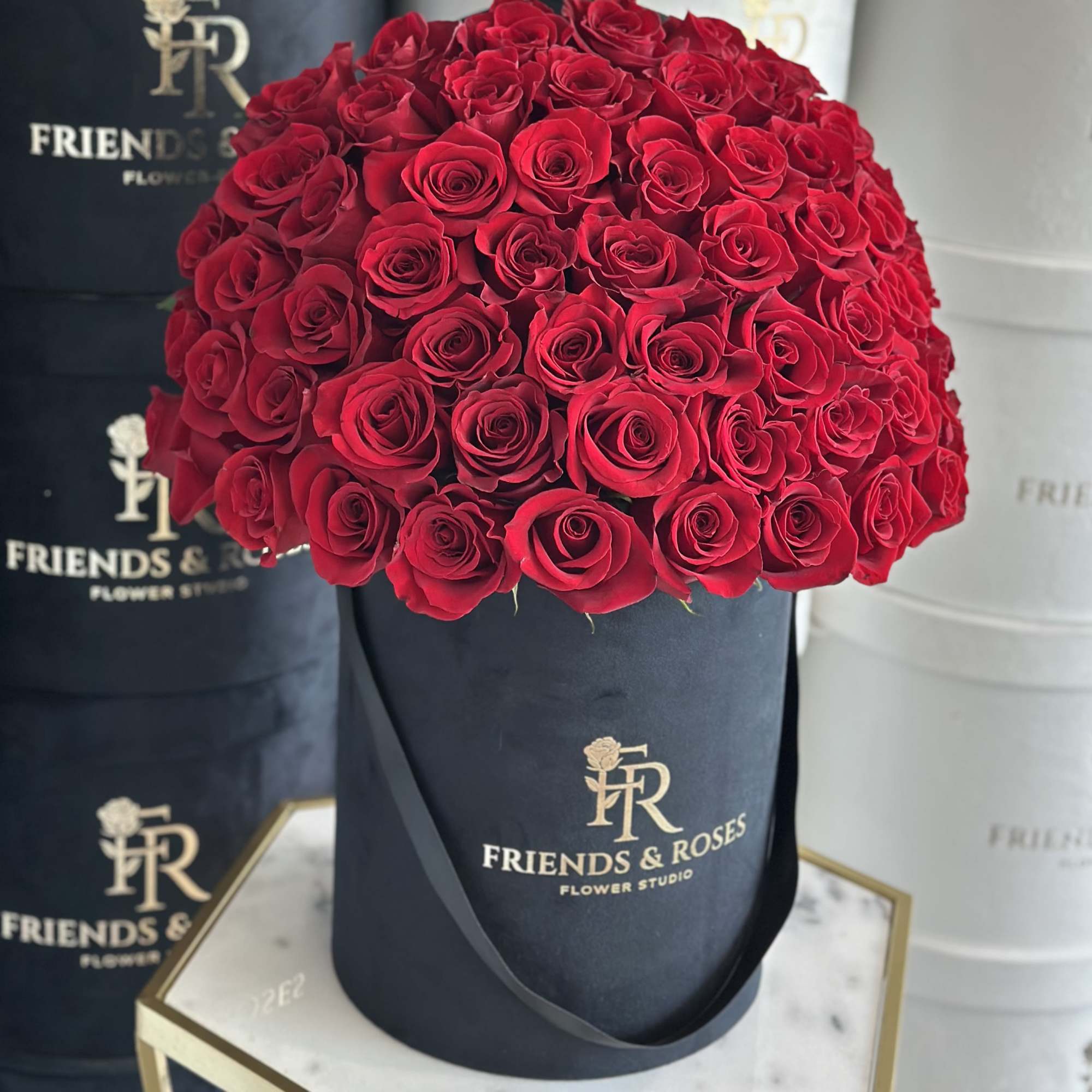 50 red roses in a black velvet box