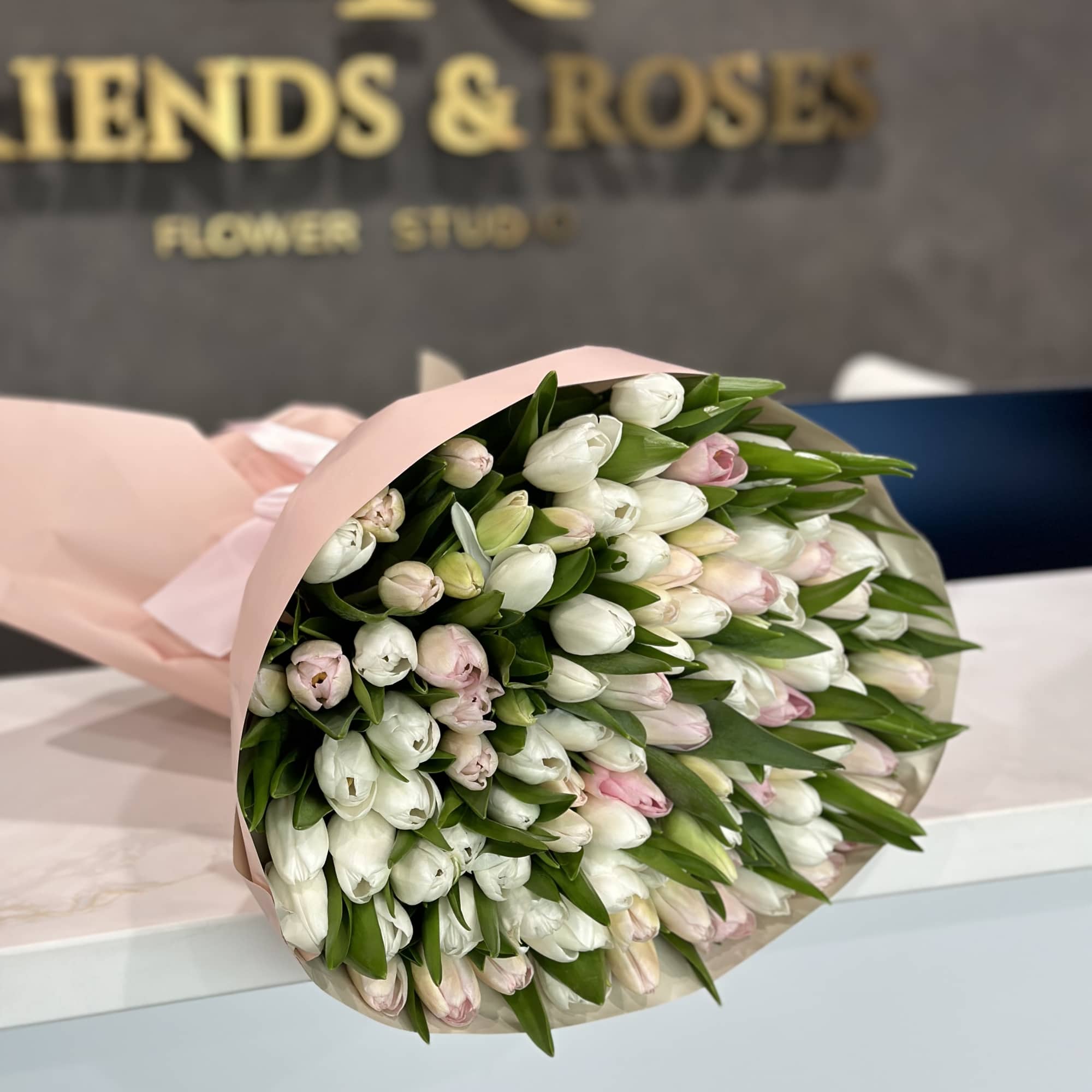 A gorgeous bouquet of 100 white and pink tulips is an excellent