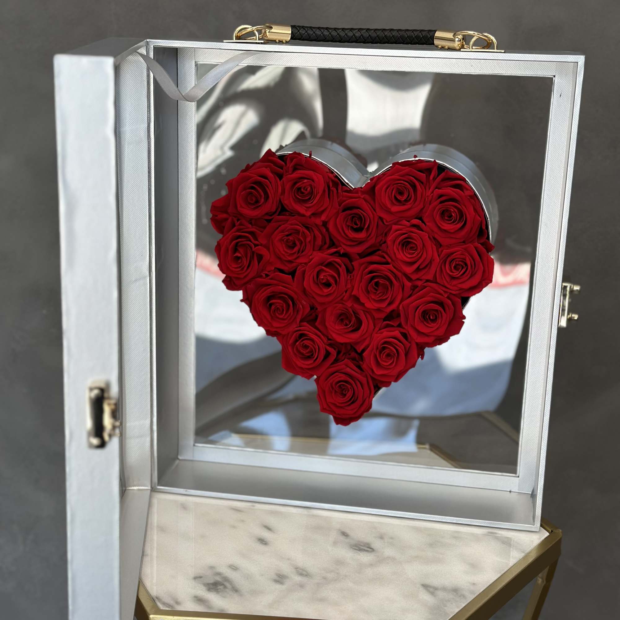 Preserved red roses in a heart suitcase box. Everyone will adore this