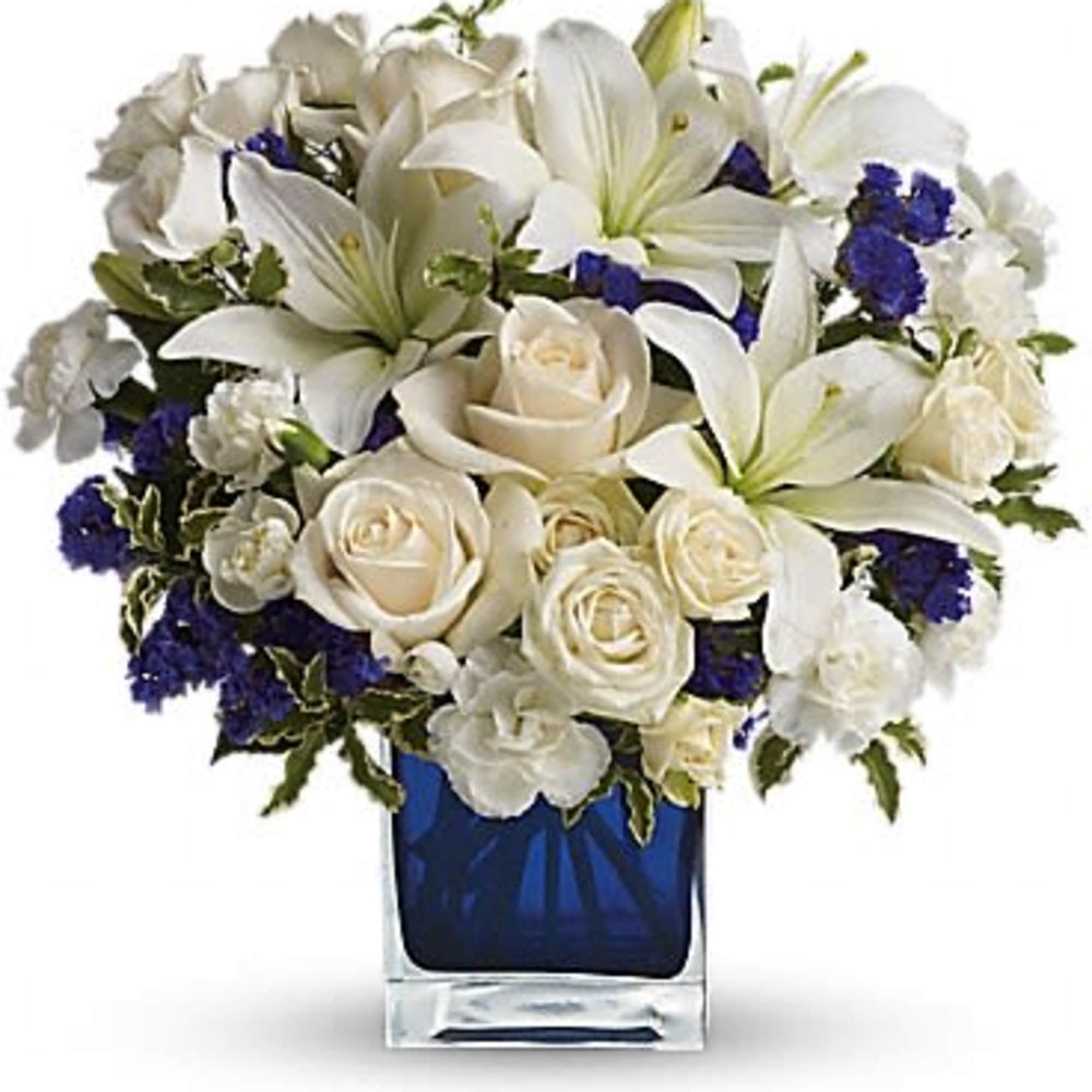 Like gazing into a clear blue sky, this serene arrangement soothes the
