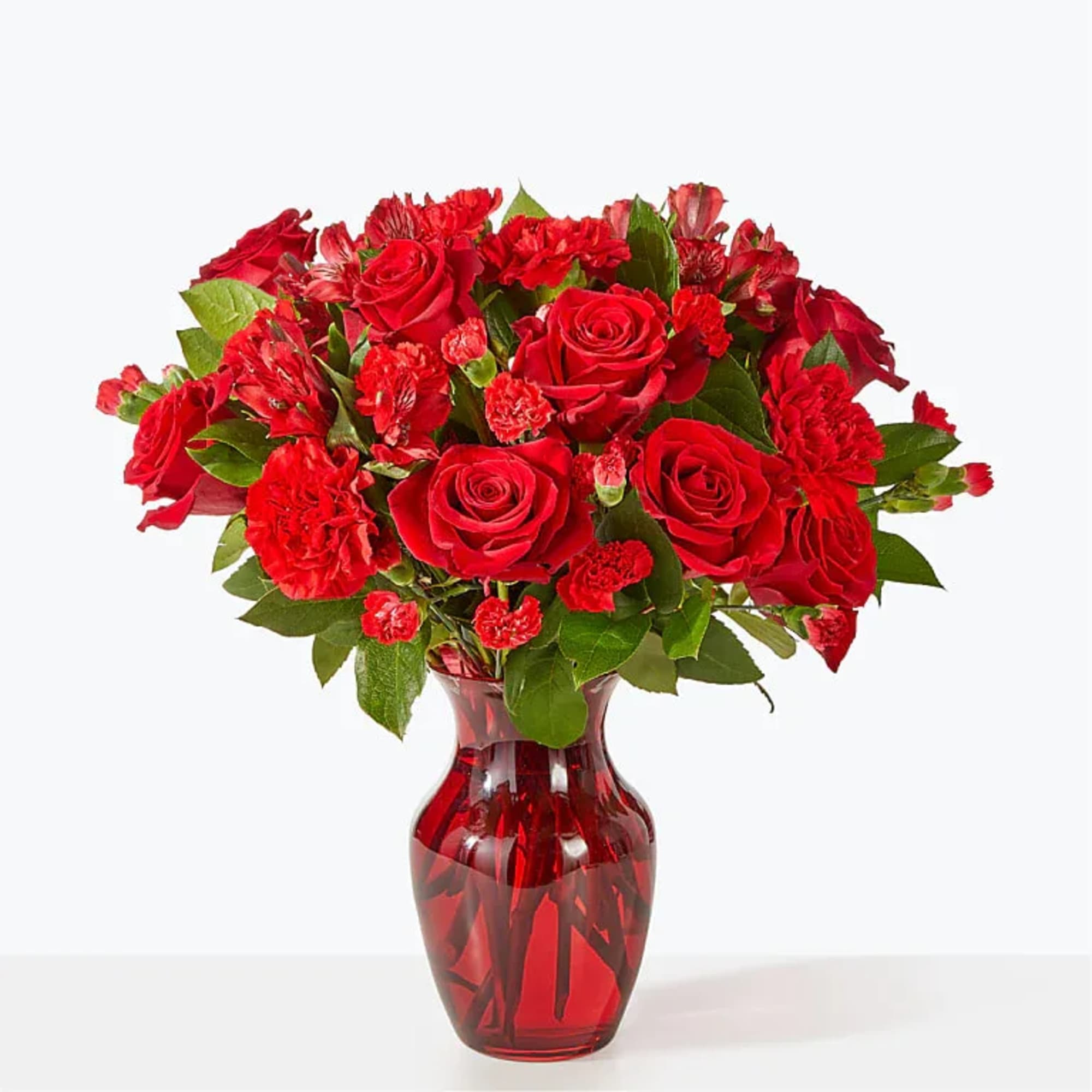 A valentine in bloom, this all red arrangement of roses, carnations and