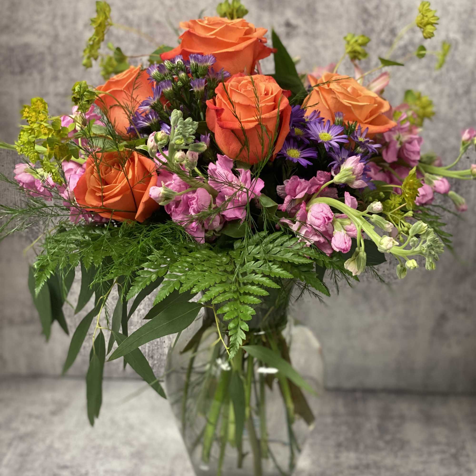 Celebrate good times with this lively bouquet. The arrangement includes roses, stock