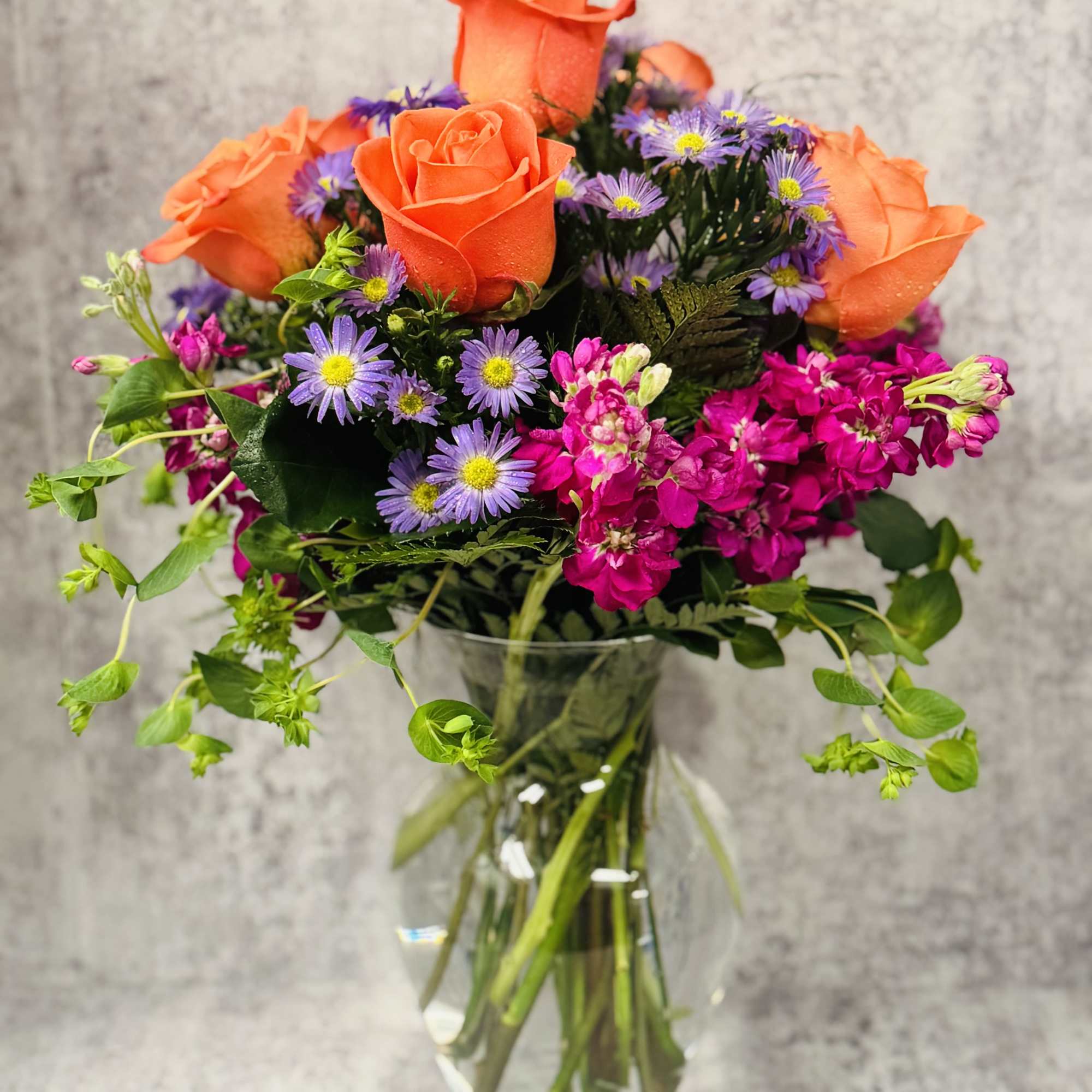 Celebrate good times with this lively bouquet. The arrangement includes roses, stock