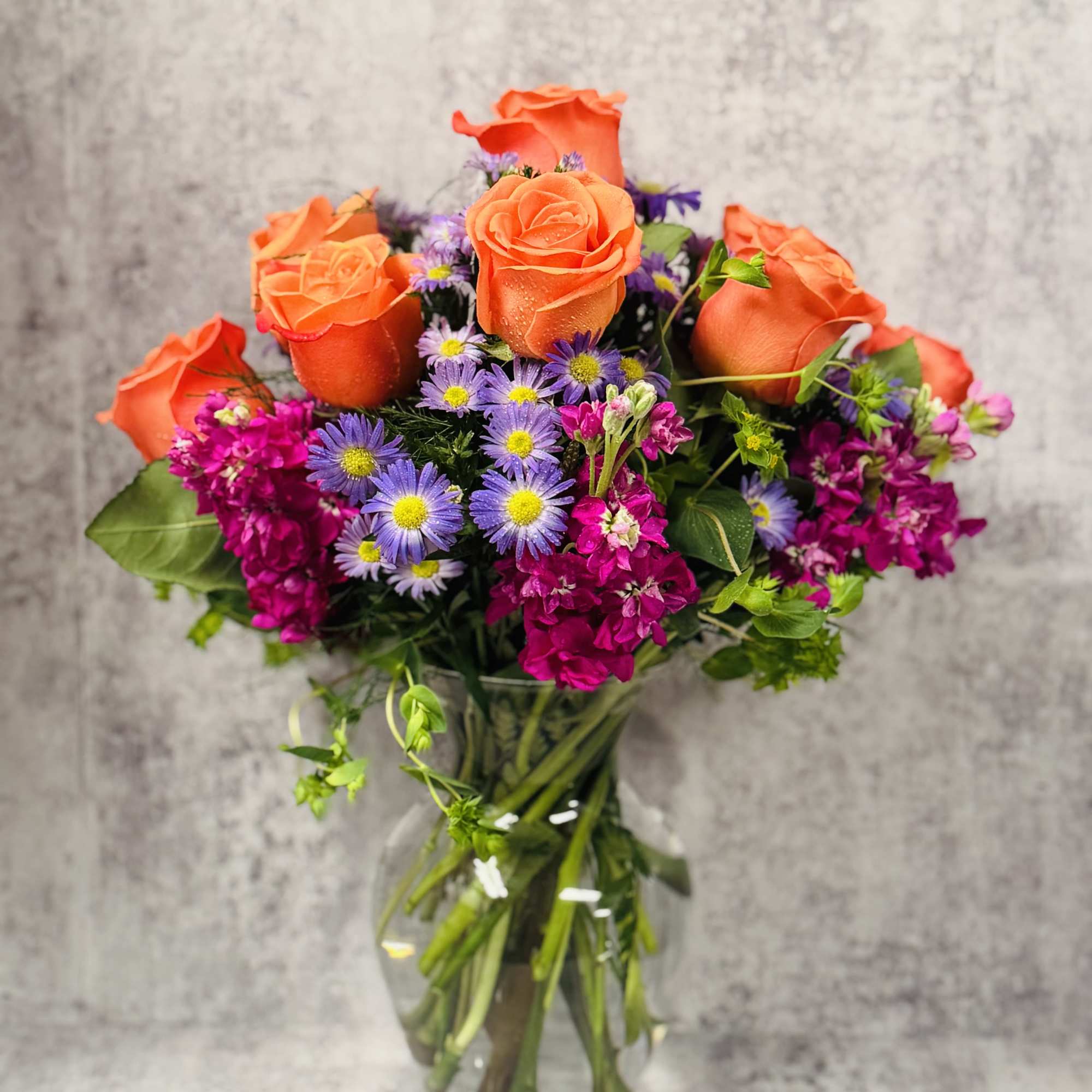 Celebrate good times with this lively bouquet. The arrangement includes roses, stock