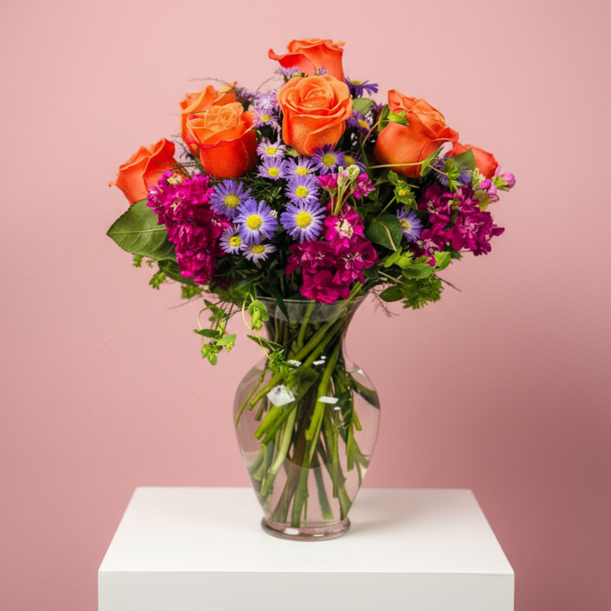 Celebrate good times with this lively bouquet. The arrangement includes roses, stock