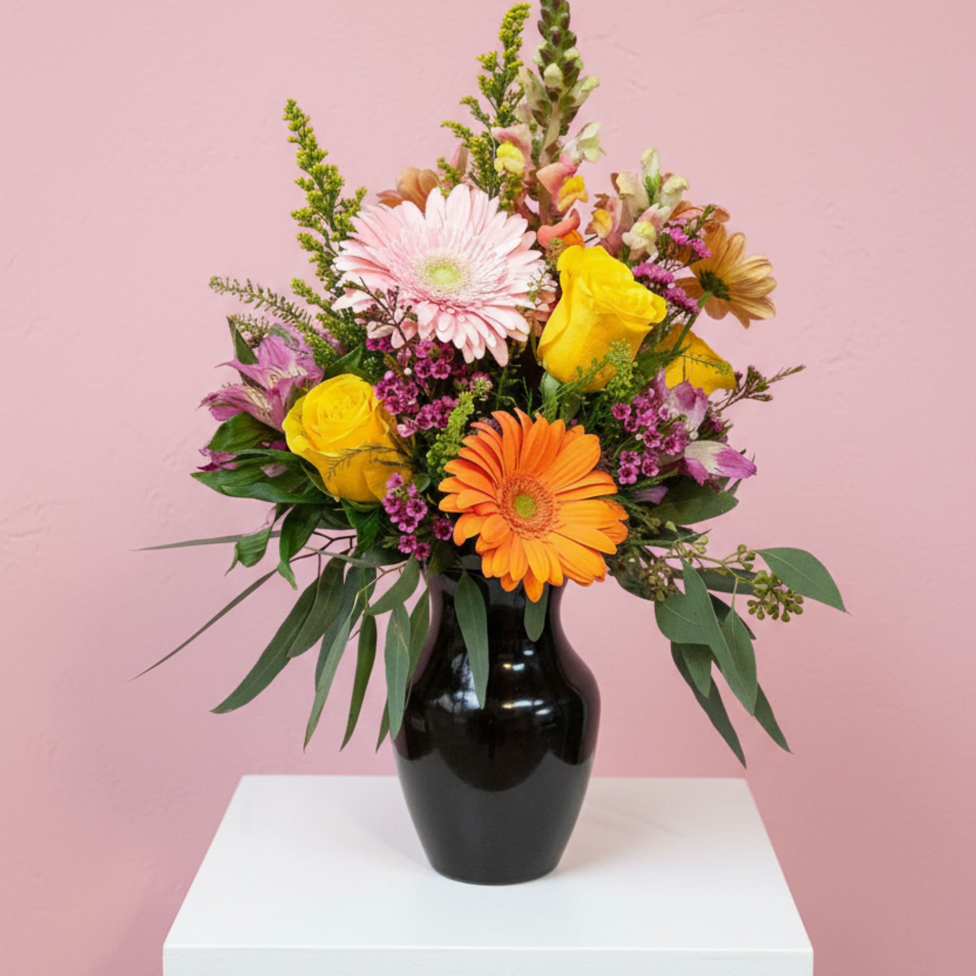 Stunning Gerbera Daisies, Snaps and Roses make this fresh vase arrangement a