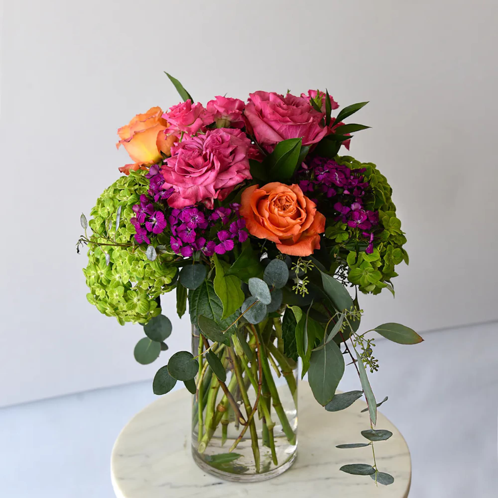 A beautiful collection of stunning premium roses with spray roses in vibrant