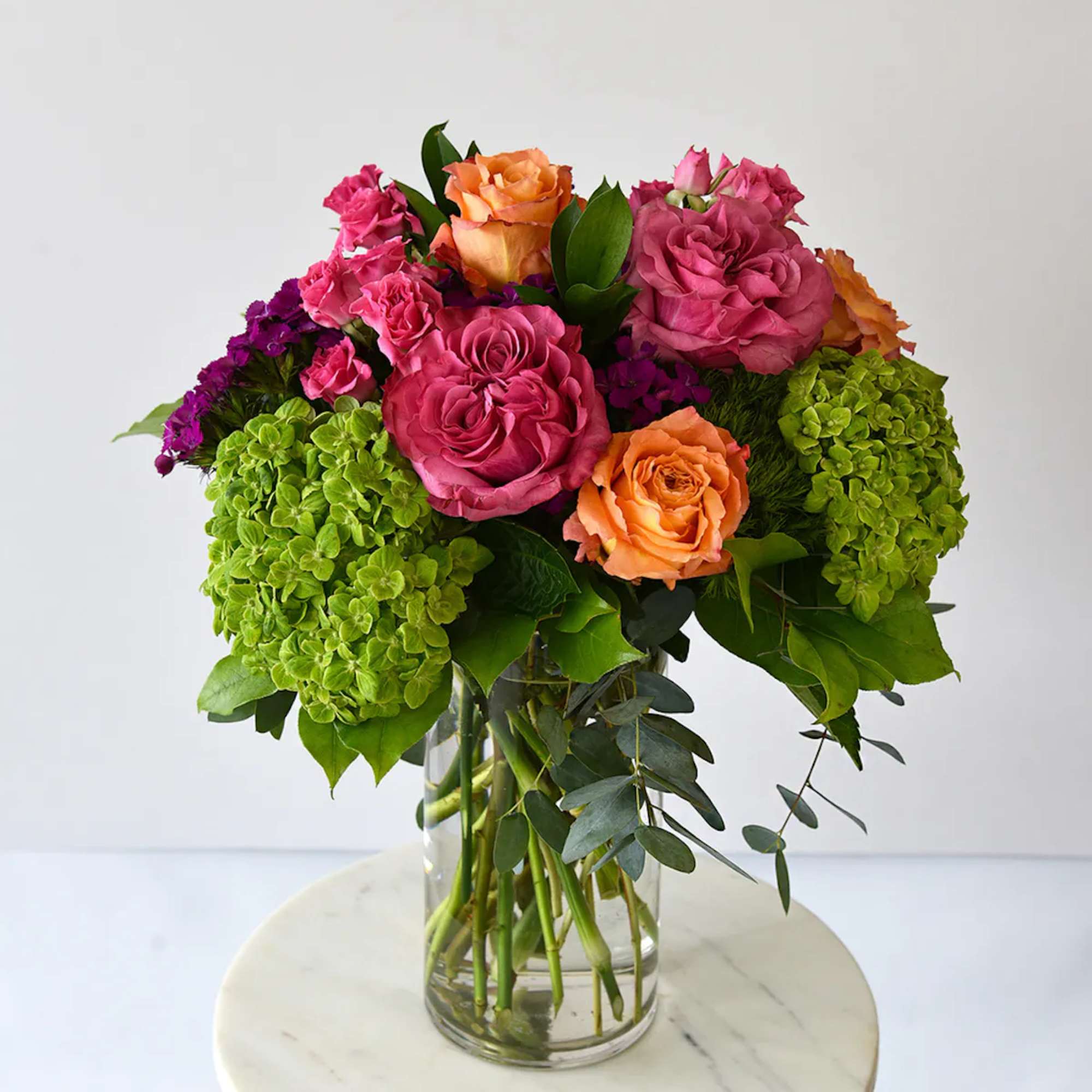 A beautiful collection of stunning premium roses with spray roses in vibrant