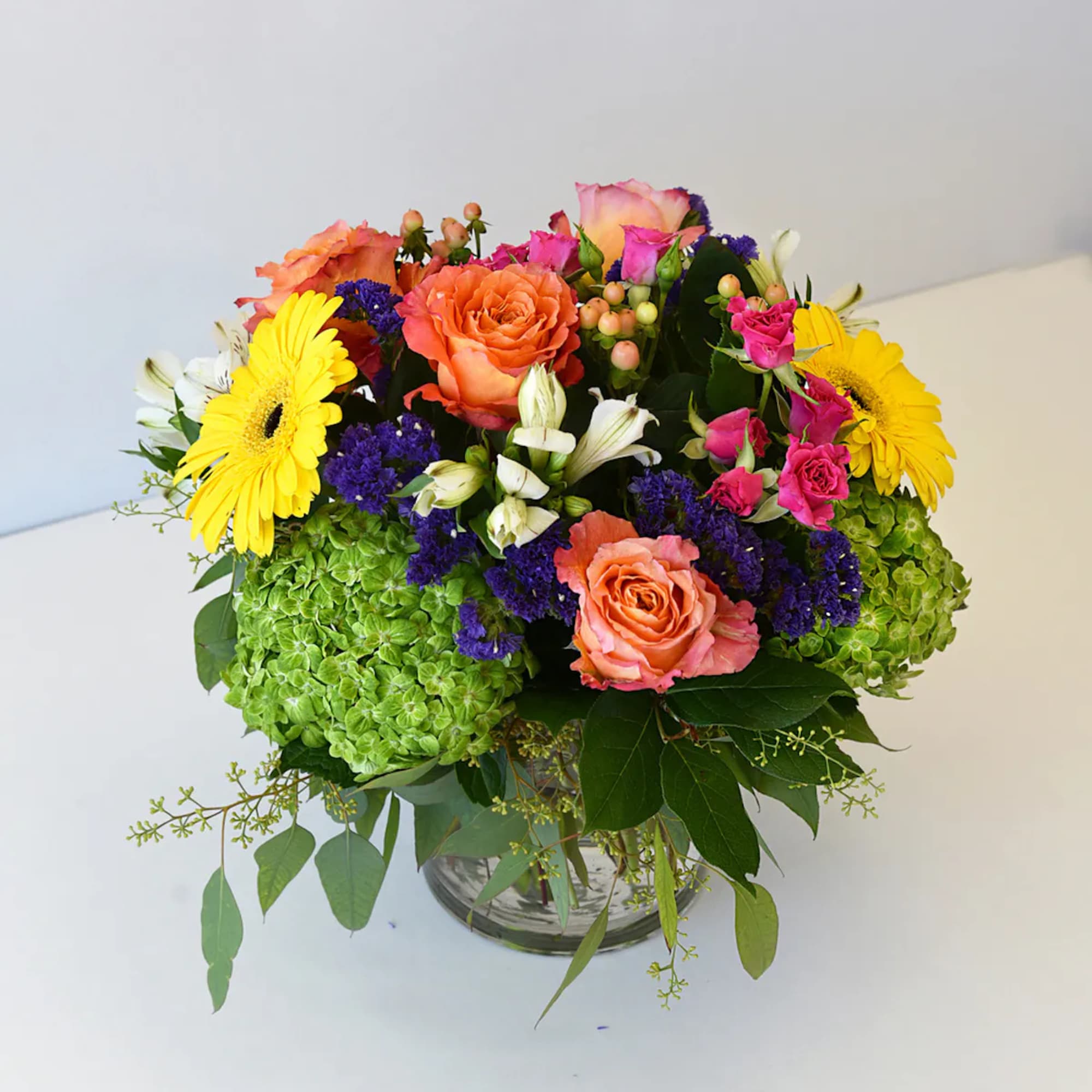 Give someone a surprise with this charming vase of flowers overflowing with