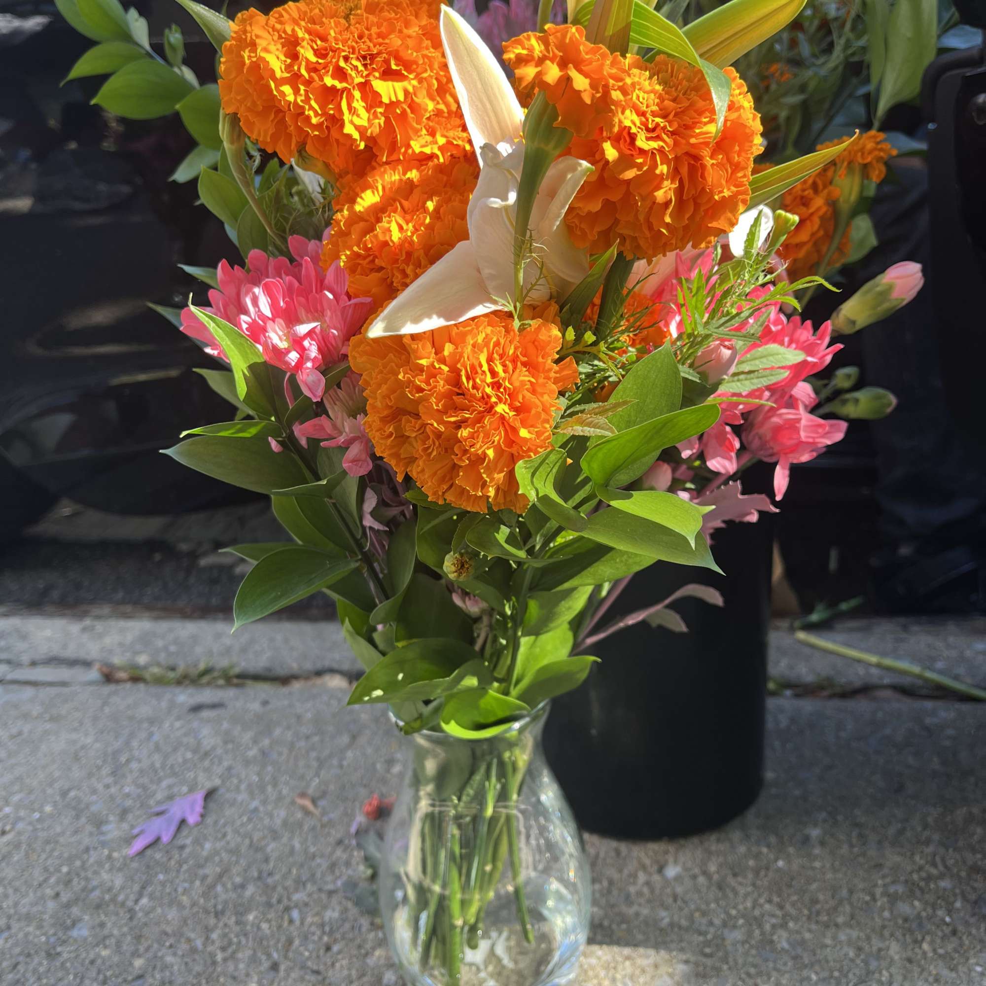 This bright beautiful marigold arrangement will cheer up anyone at anytime considering