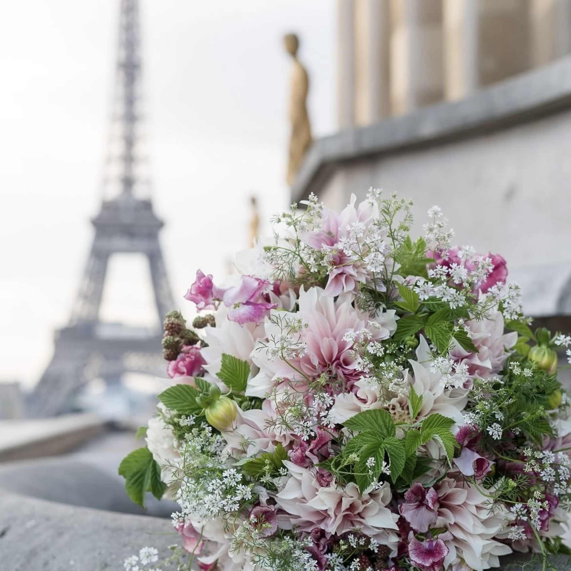This romantic Parisian style arrangement boasts an abundance of natural gentle blooms