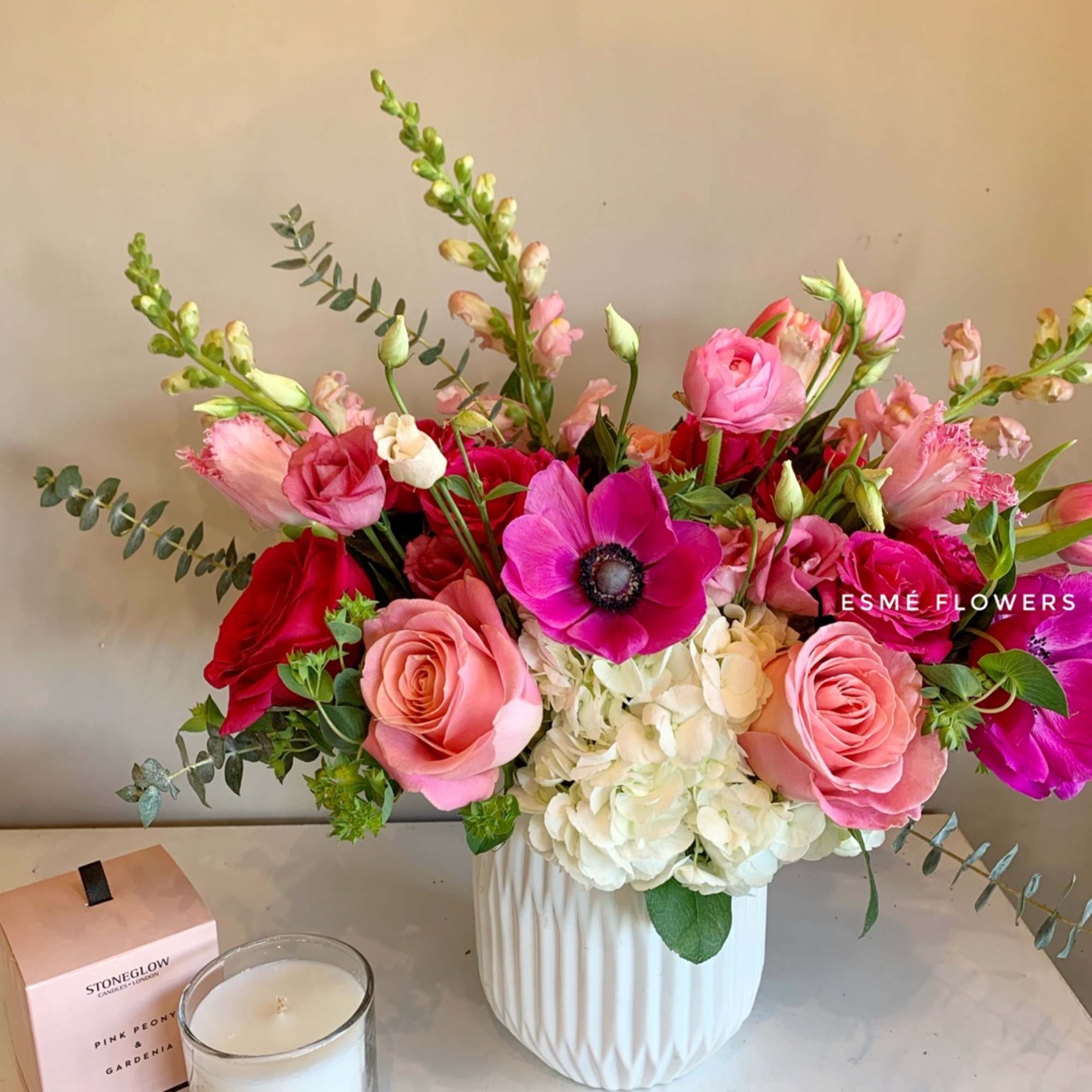 An exquisite arrangement for your loved one featuring anemones, premium hermosa roses