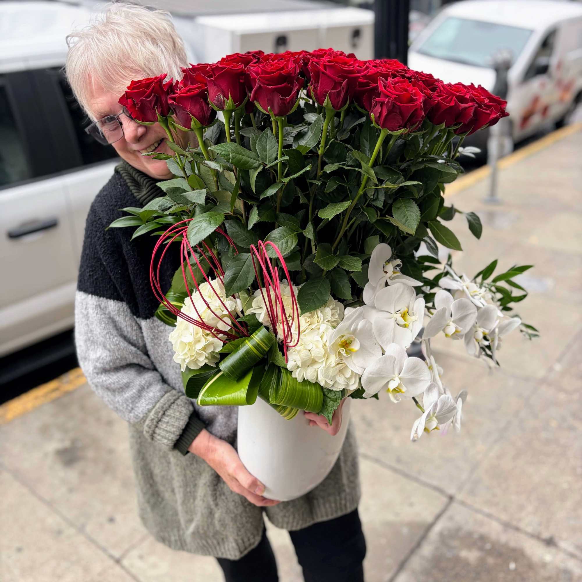 She's big.  She's beautiful.  She's FIFTY

Fifty long-stemmed red roses tower
