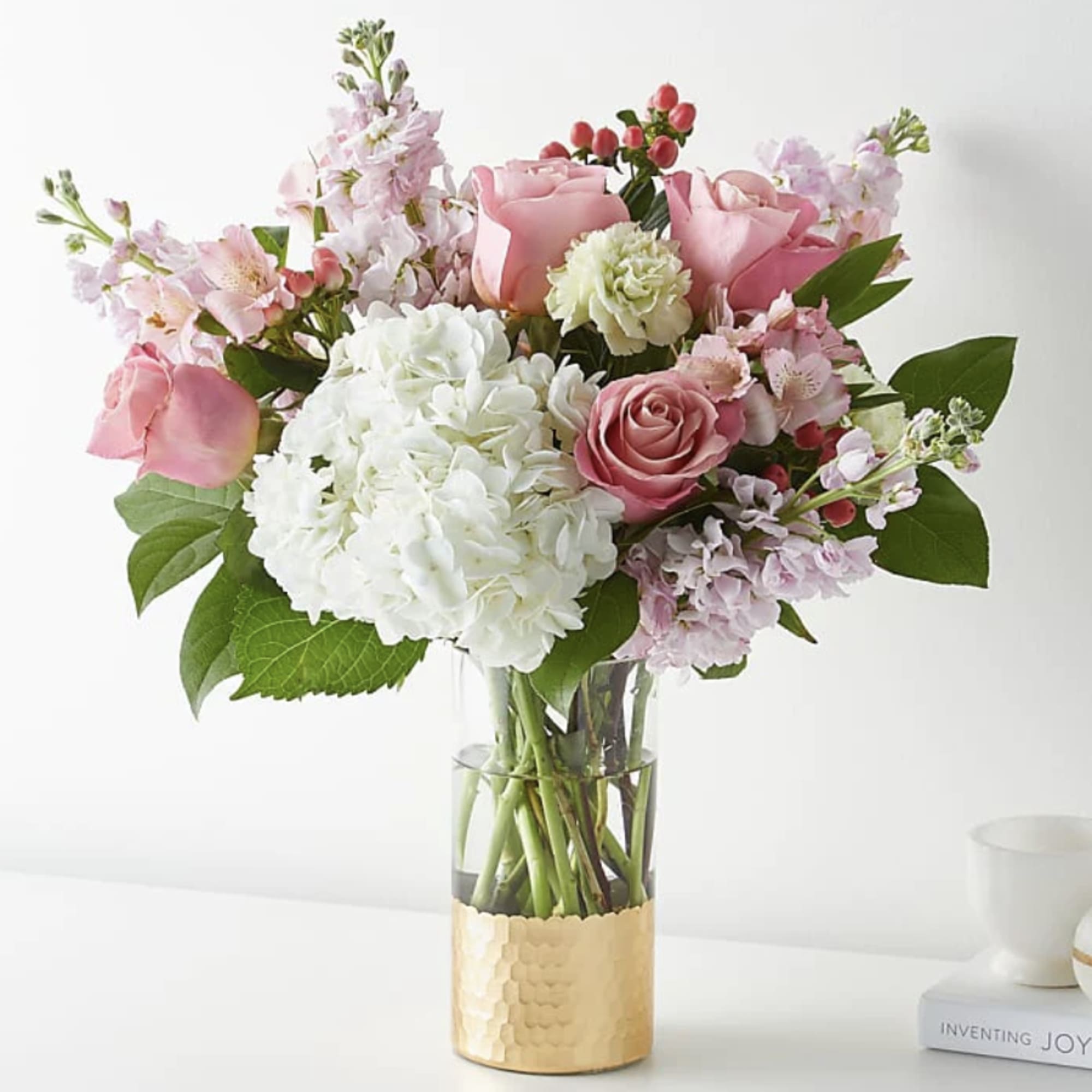 Tickle them pink with this elegant arrangement of roses, alstroemeria, hypericum berries