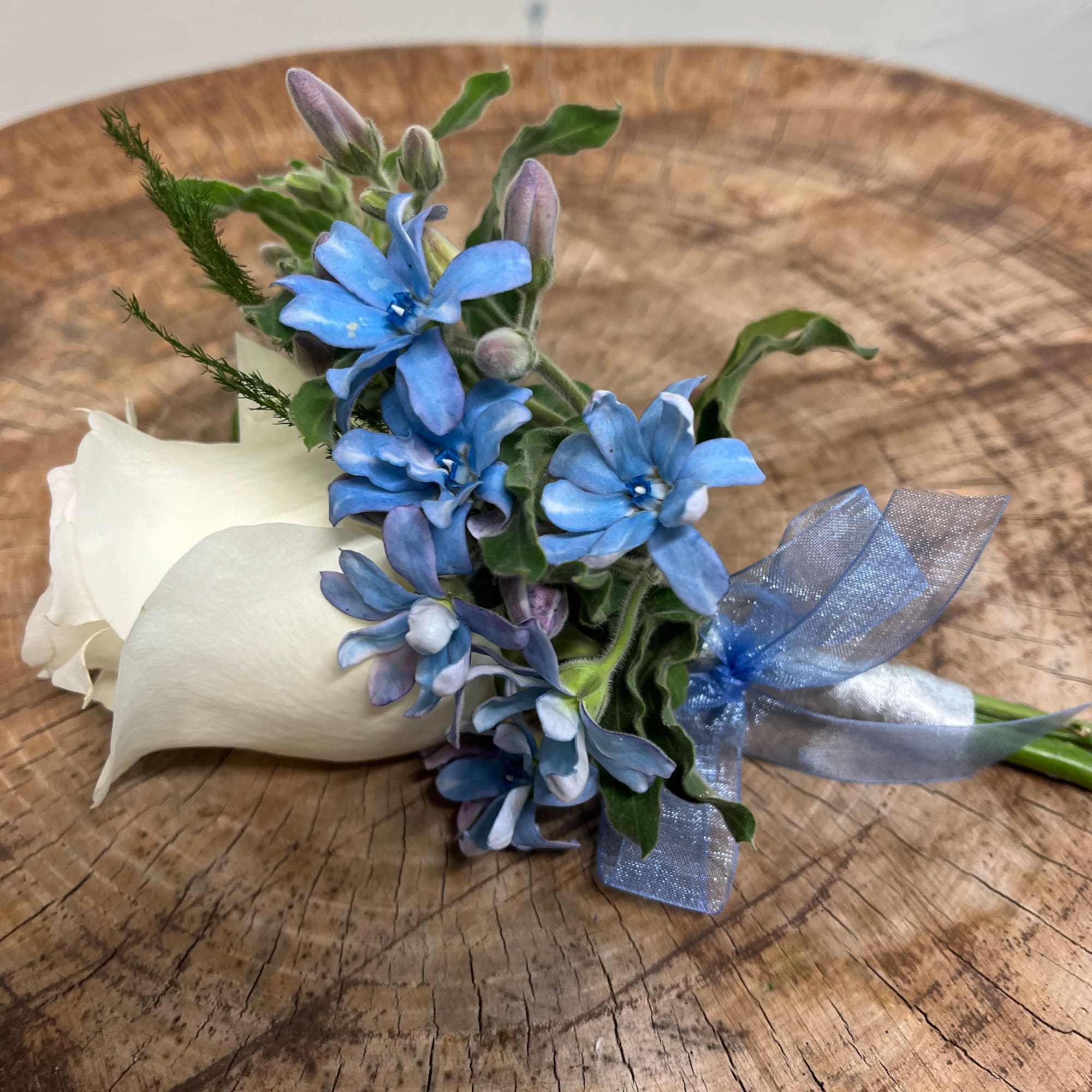 Your beau will look SO handsome wearing one of our boutonniere creations!