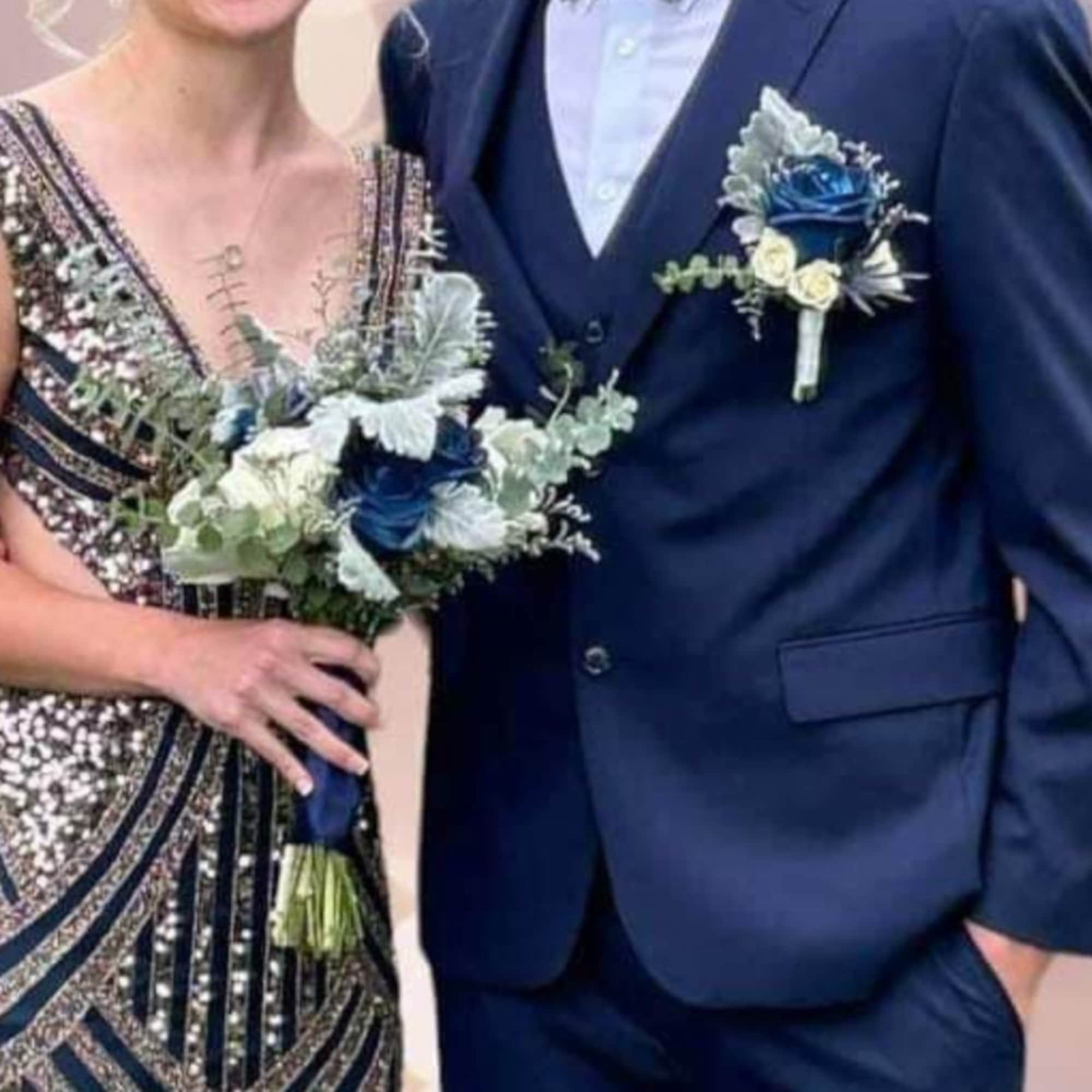 Your beau will look SO handsome wearing one of our boutonniere creations!