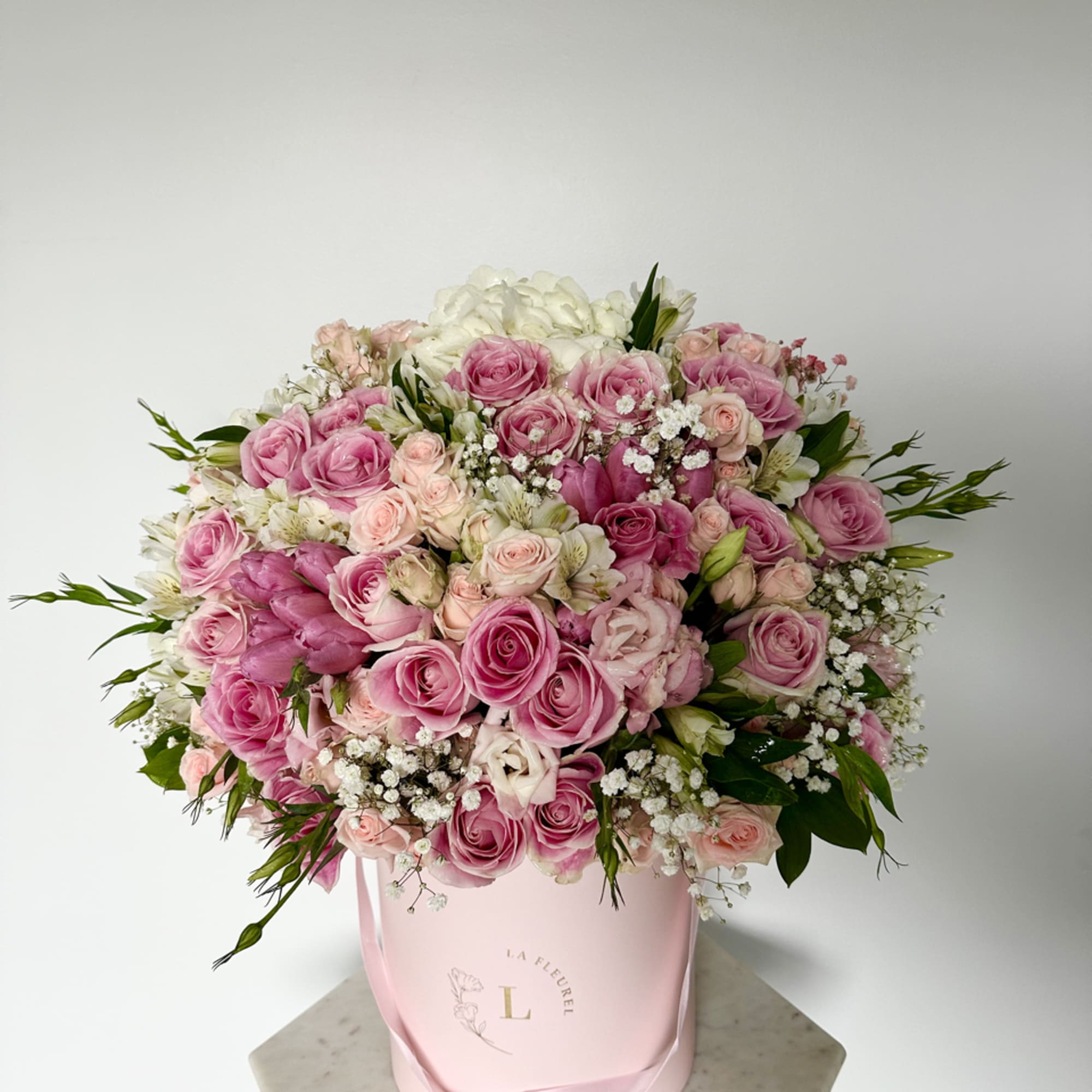 This beautiful arrangement filled with the roses, spray roses, hydrangeas and greens