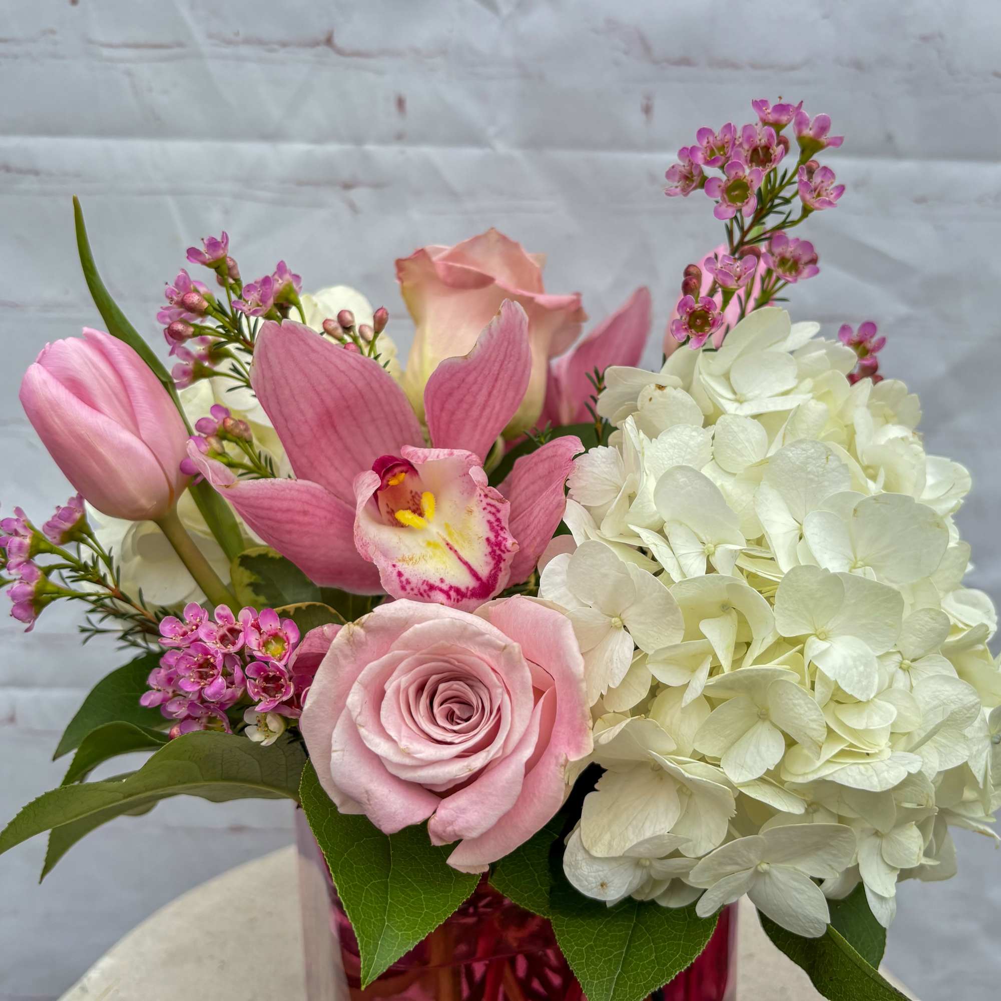 This beautiful arrangement contains white hydrangeas, blush pink/whites, blush pink hyacinths, white/blush