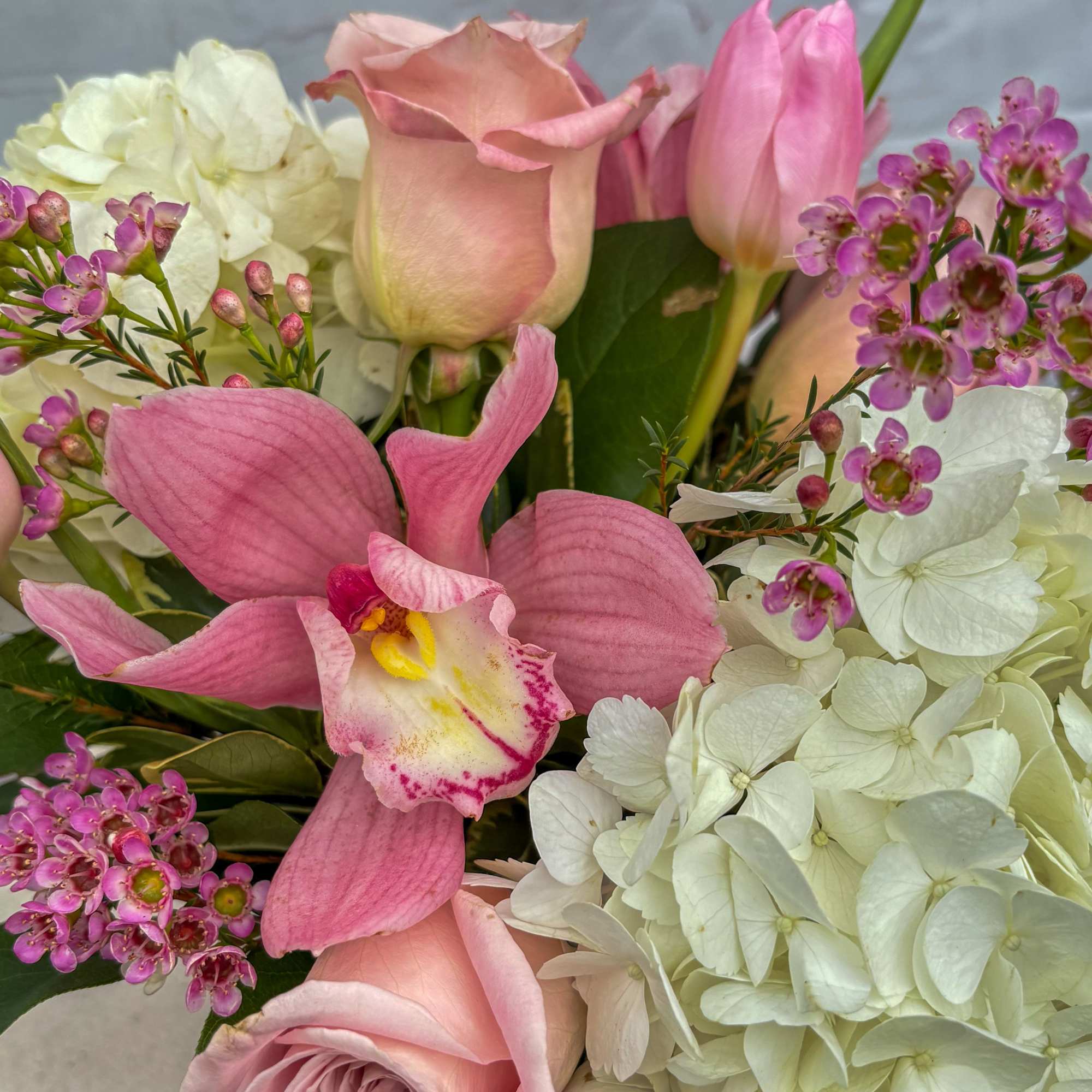 This beautiful arrangement contains white hydrangeas, blush pink/whites, blush pink hyacinths, white/blush