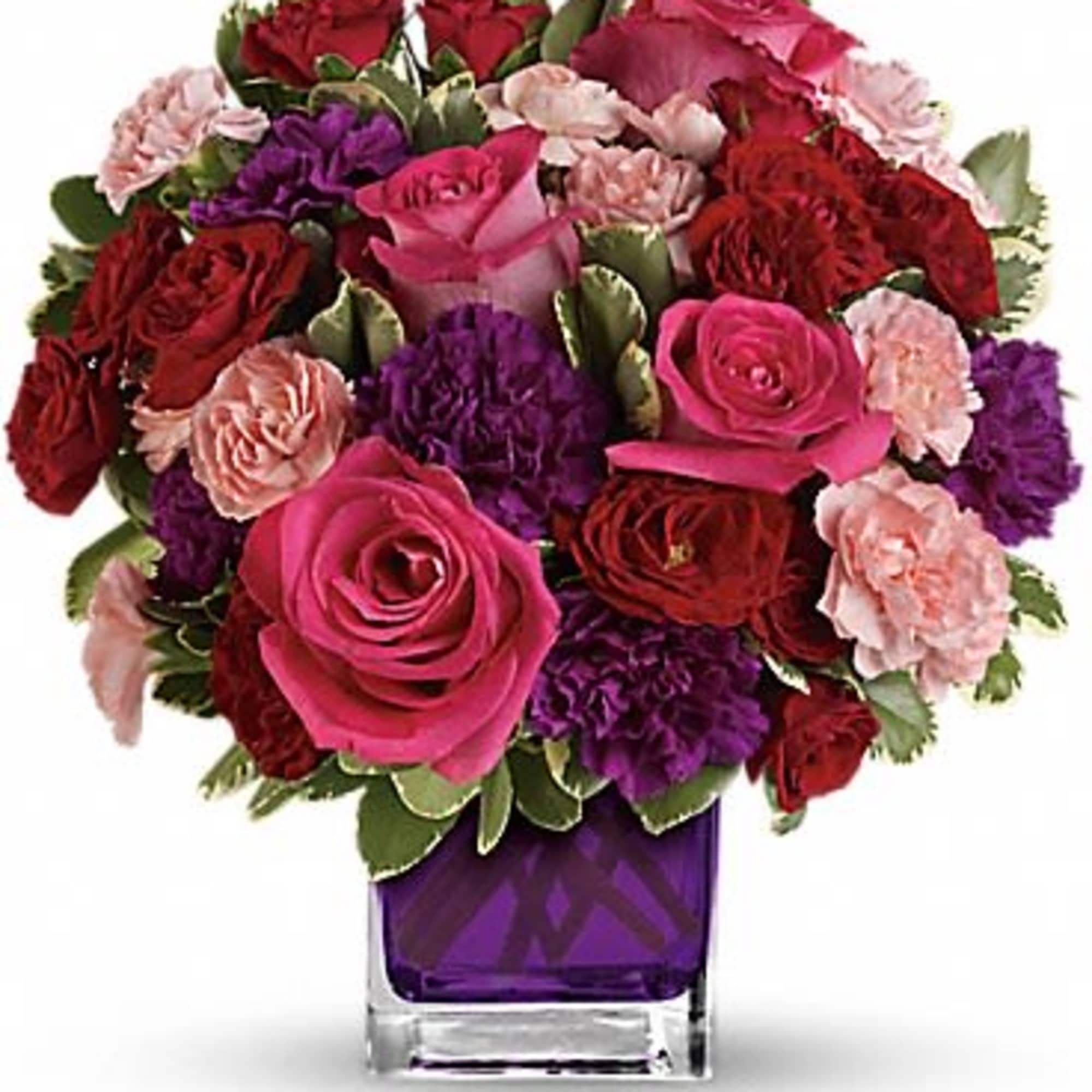 Pure romance. Hot pink roses and dark red spray roses are brightly