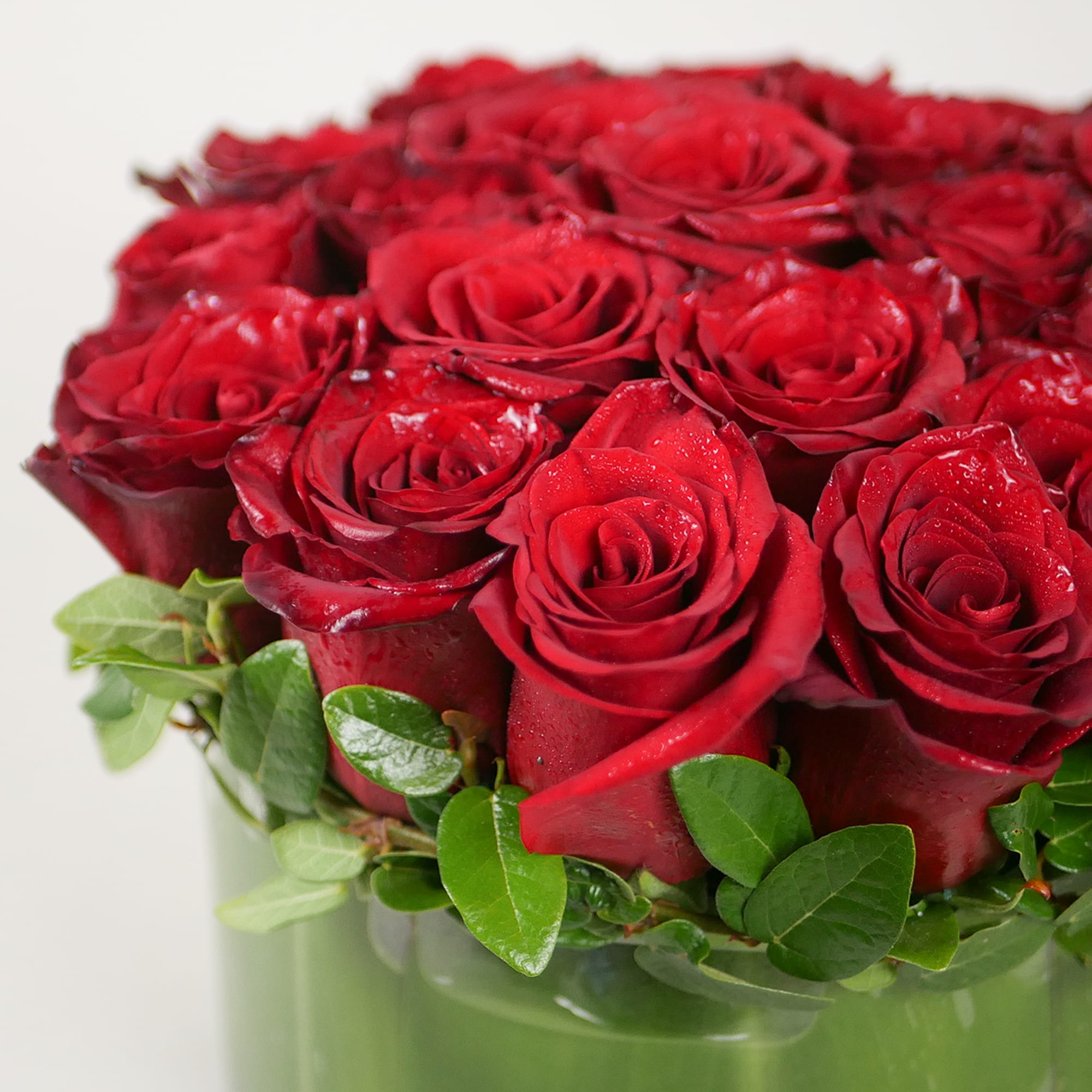 This classic design features 20 premium red roses in an 8" low