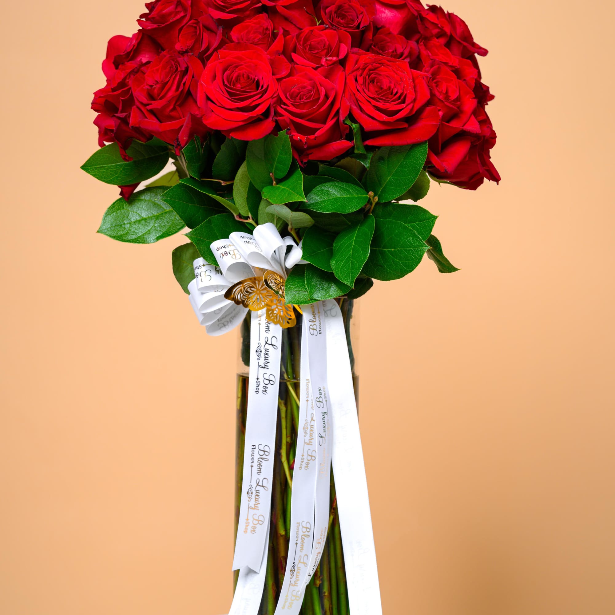 Our signature red rose arrangement featuring premium blooms, rich greenery, and an