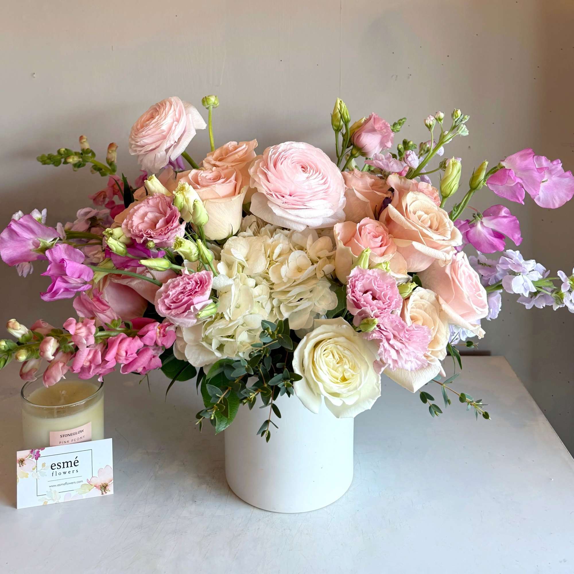 Soft, romantic, and timeless. This arrangement blends blush pink and creamy white