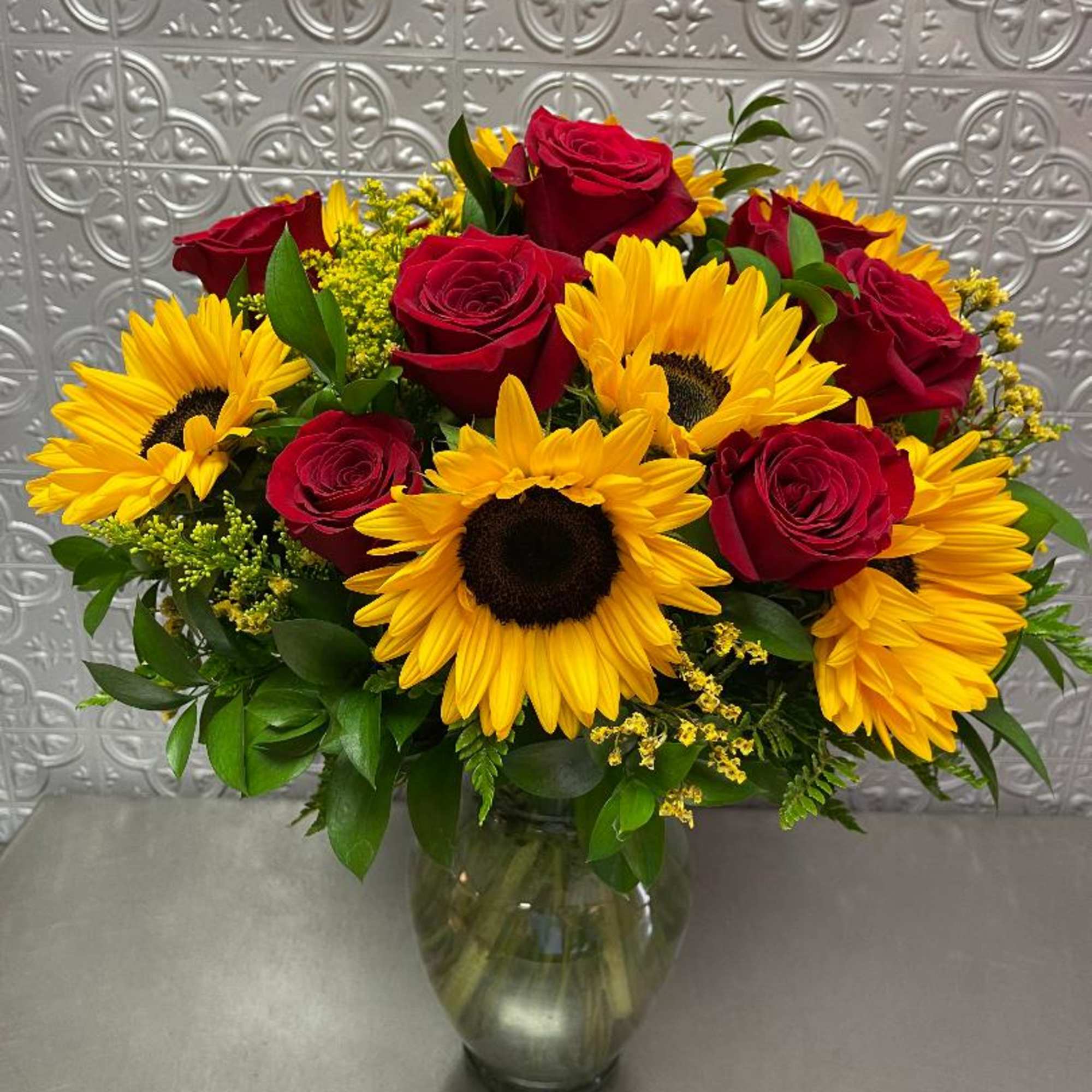 a combination of red roses and sunflowers other color roses by request