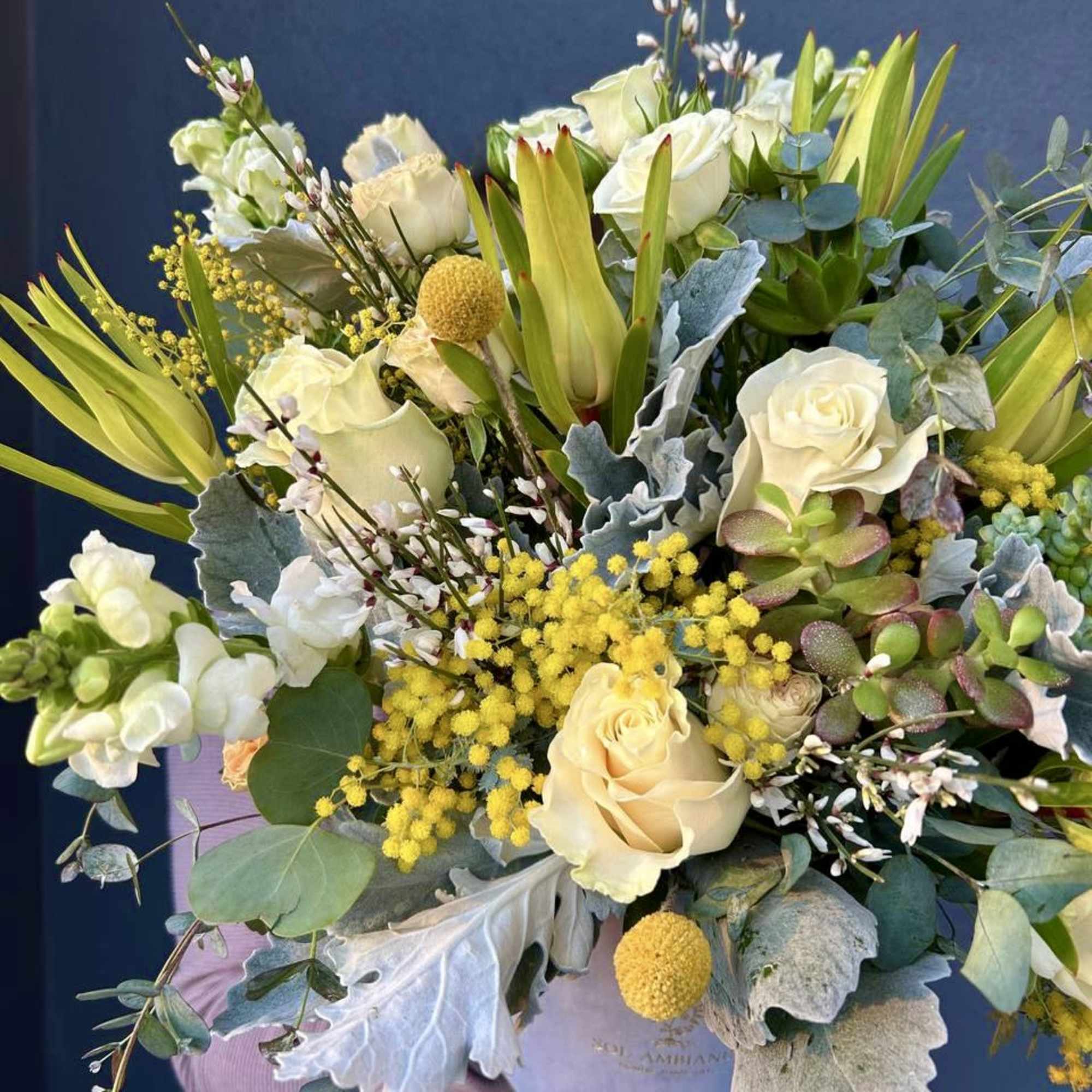 A beautiful velvet blue logo box full of gorgeous flowers. Large and