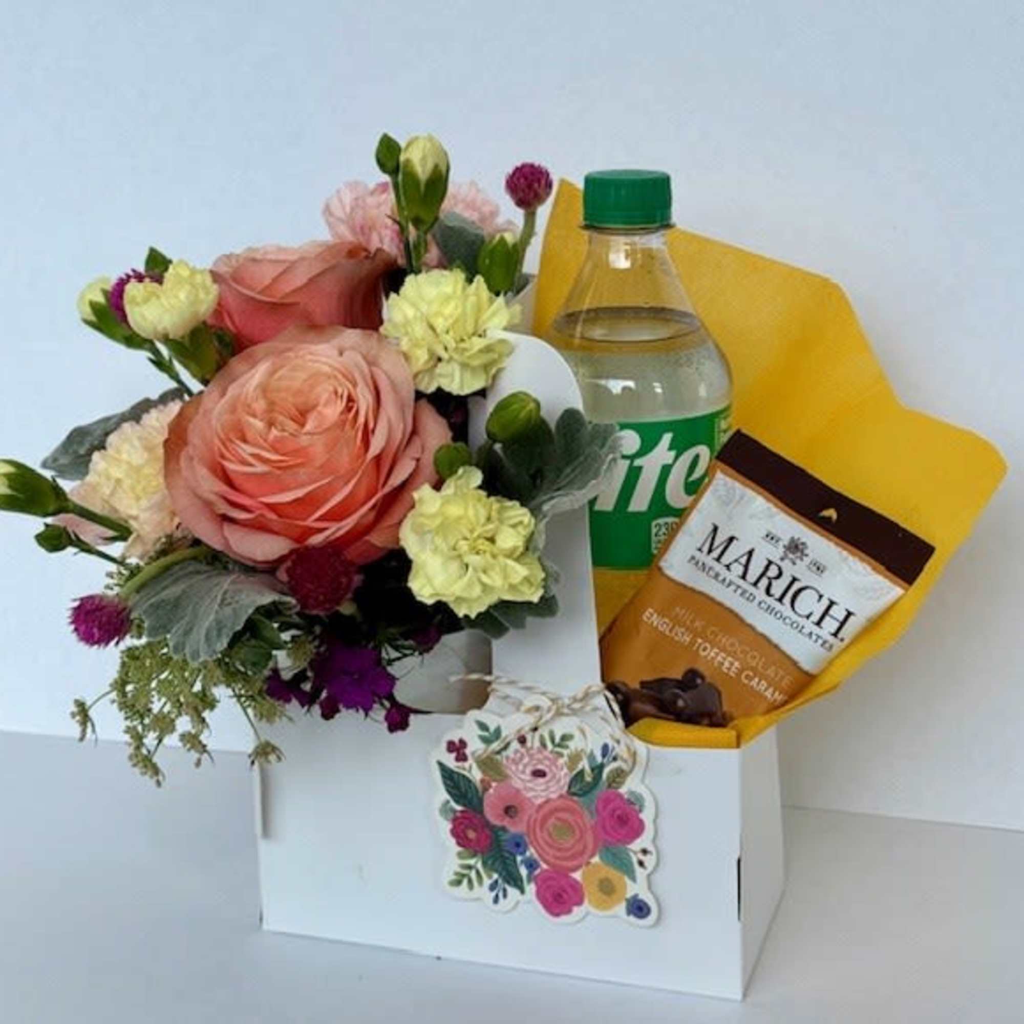 Send a sweet surprise with a charming arrangement of seasonal flowers, 1soda