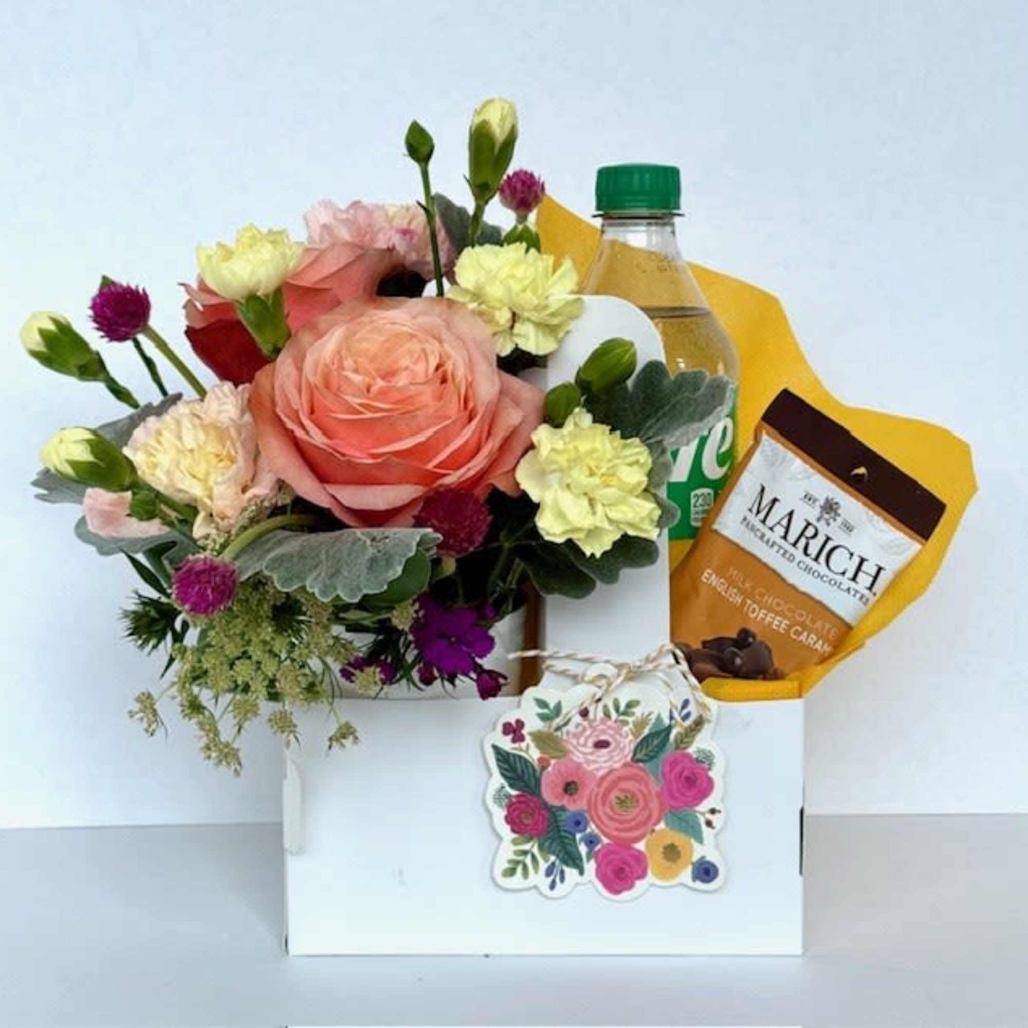 Send a sweet surprise with a charming arrangement of seasonal flowers, 1soda