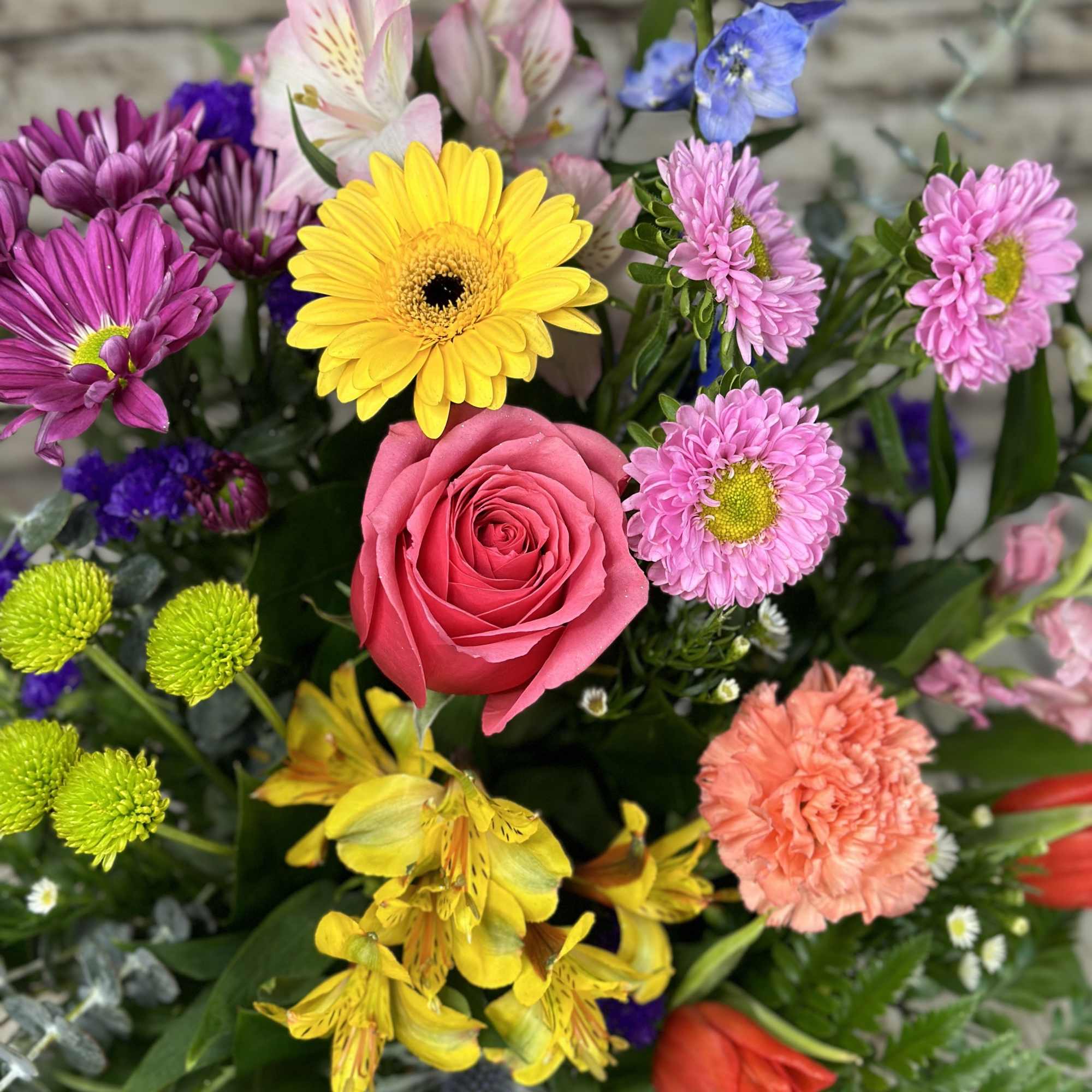 The Cutting Garden arrangement is a vibrant celebration of nature's finest blooms.