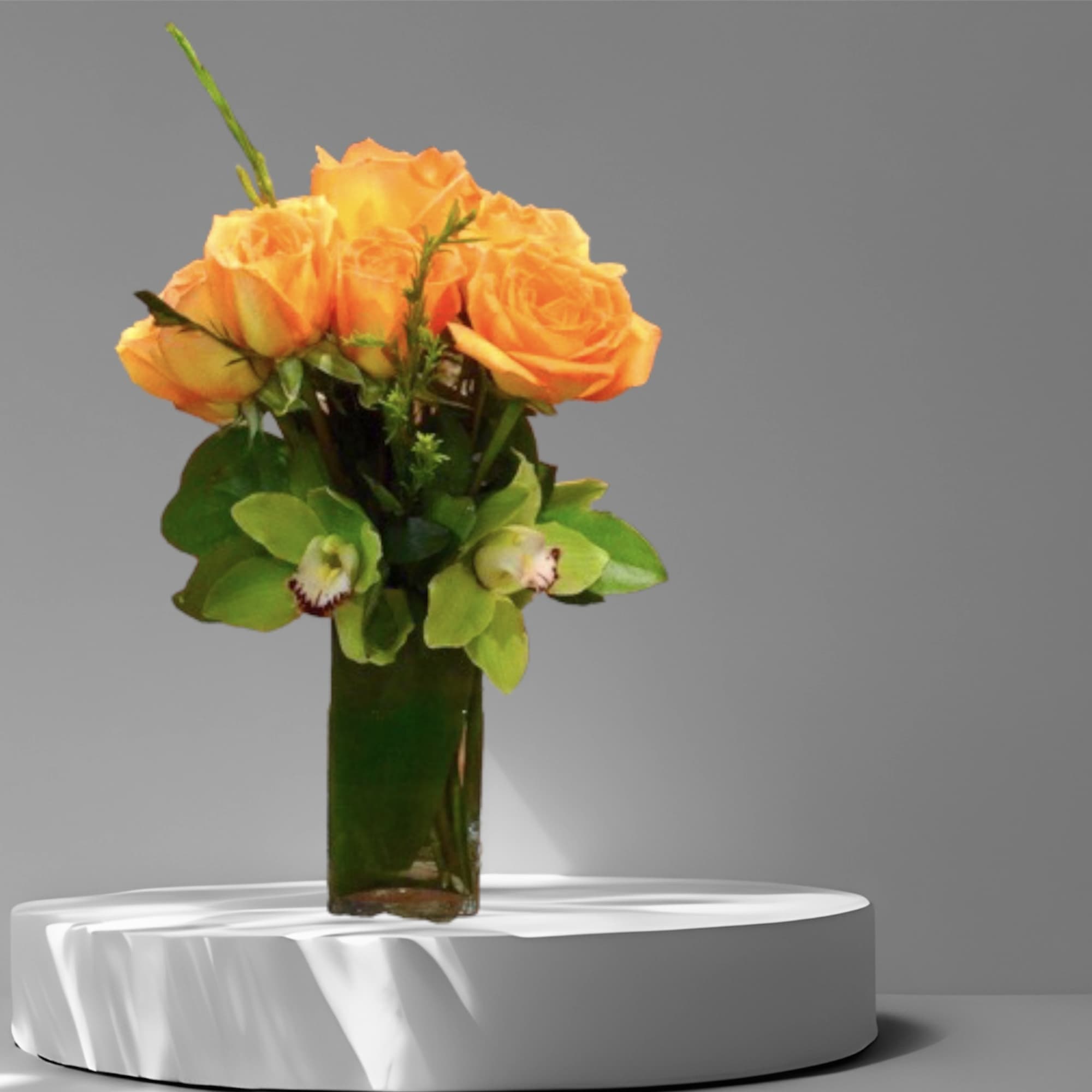 One dozen orange roses with green orchids in a glass vase.

Standard- one