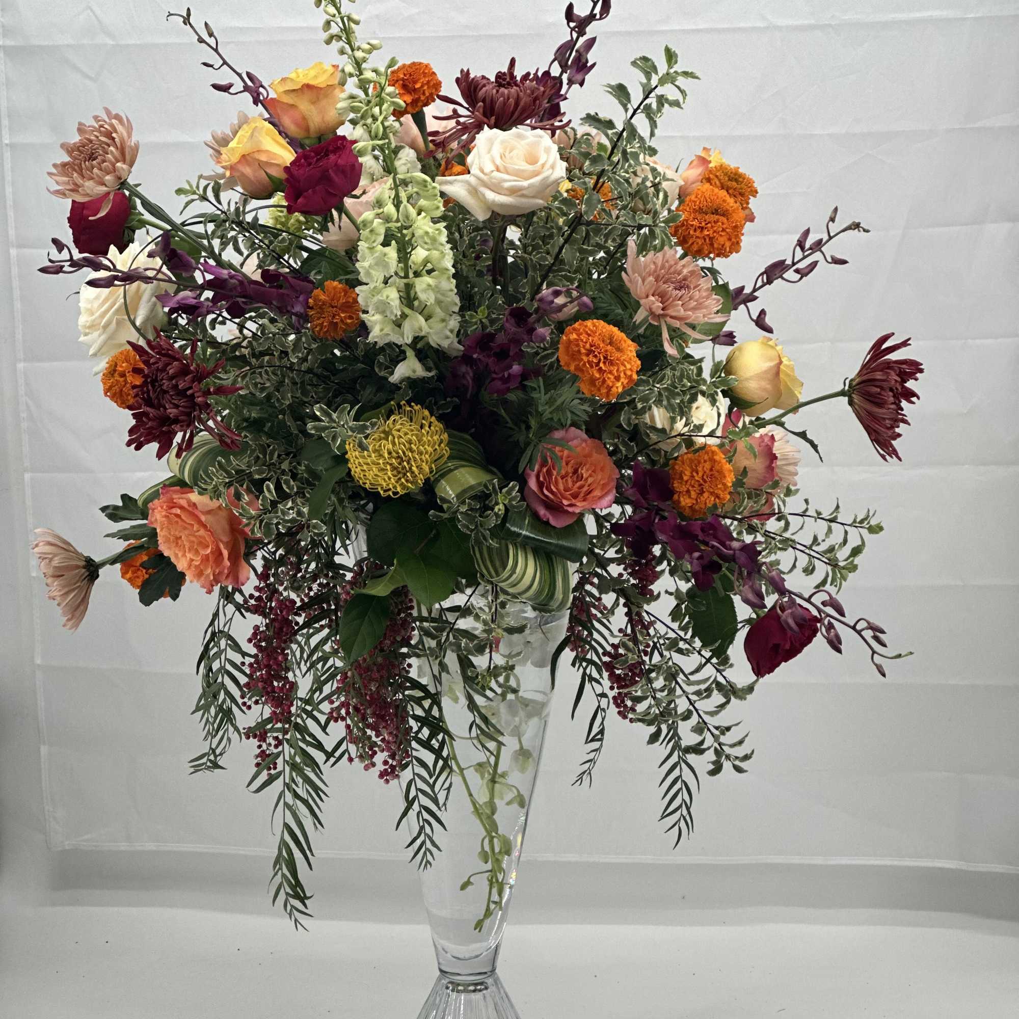 This is a Tall floral arrangement with very generous ,editorial presence -artful