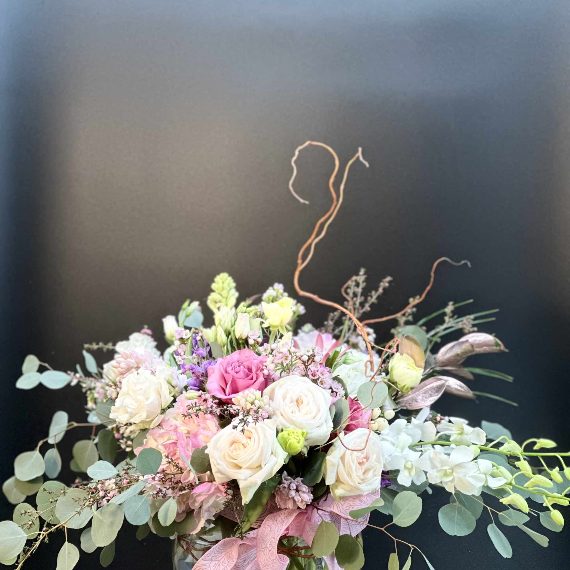 A beautiful handcrafted design round globe floral arrangement, designed  with balance