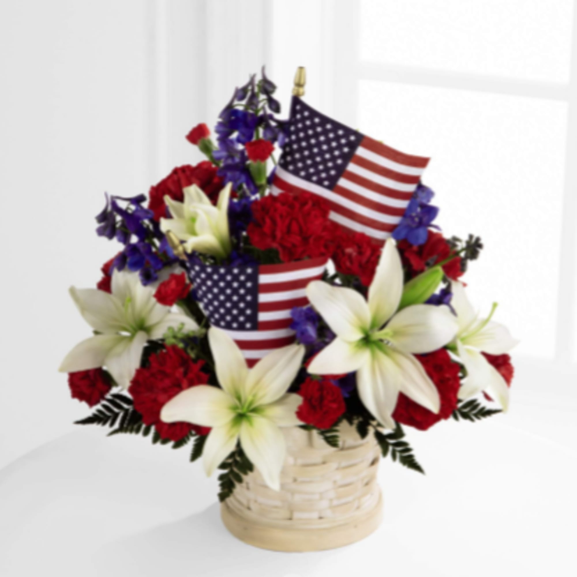 The American Glory Basket bursts with patriotic pride and heartfelt beauty. Blue