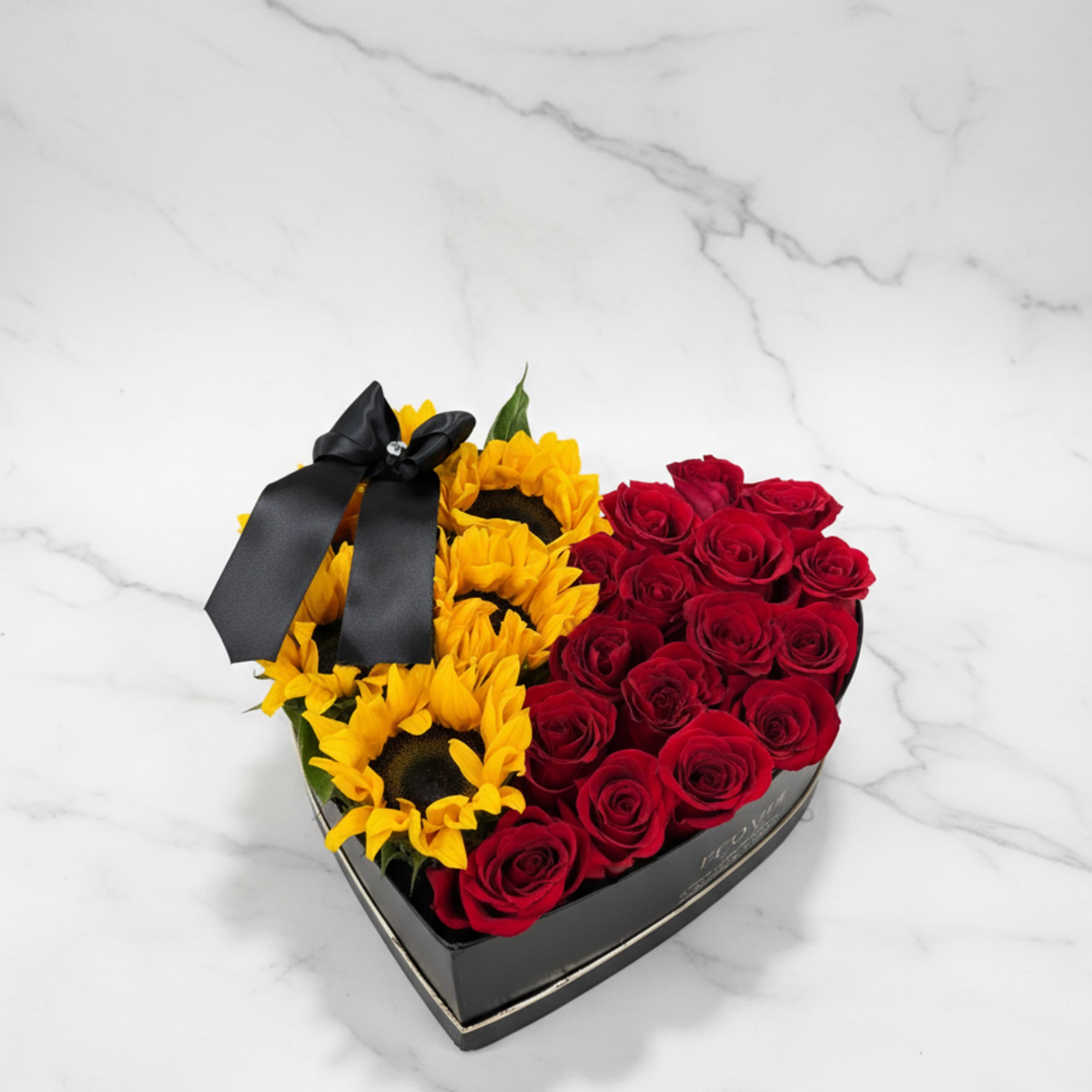 A heart-shaped box featuring a half-and-half design of classic red roses and
