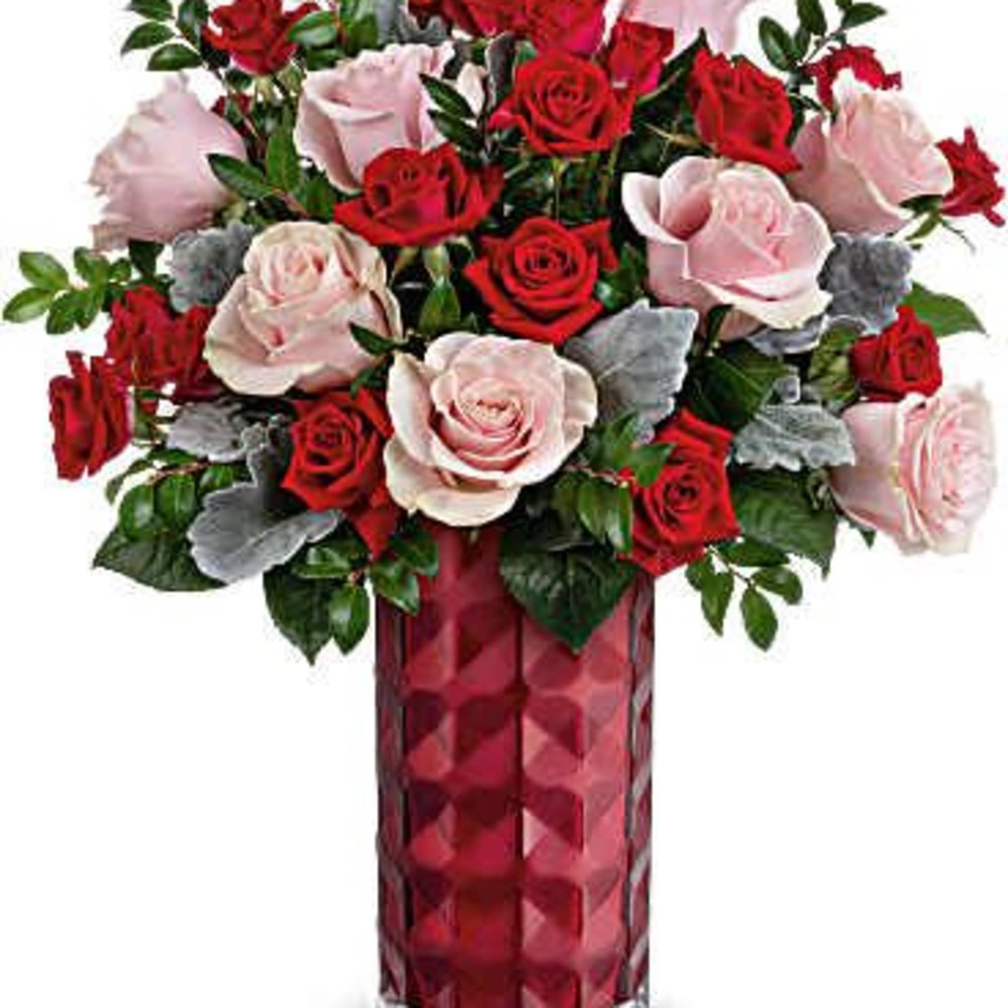 This lovely Valentine's Day arrangement features pink roses and red spray roses