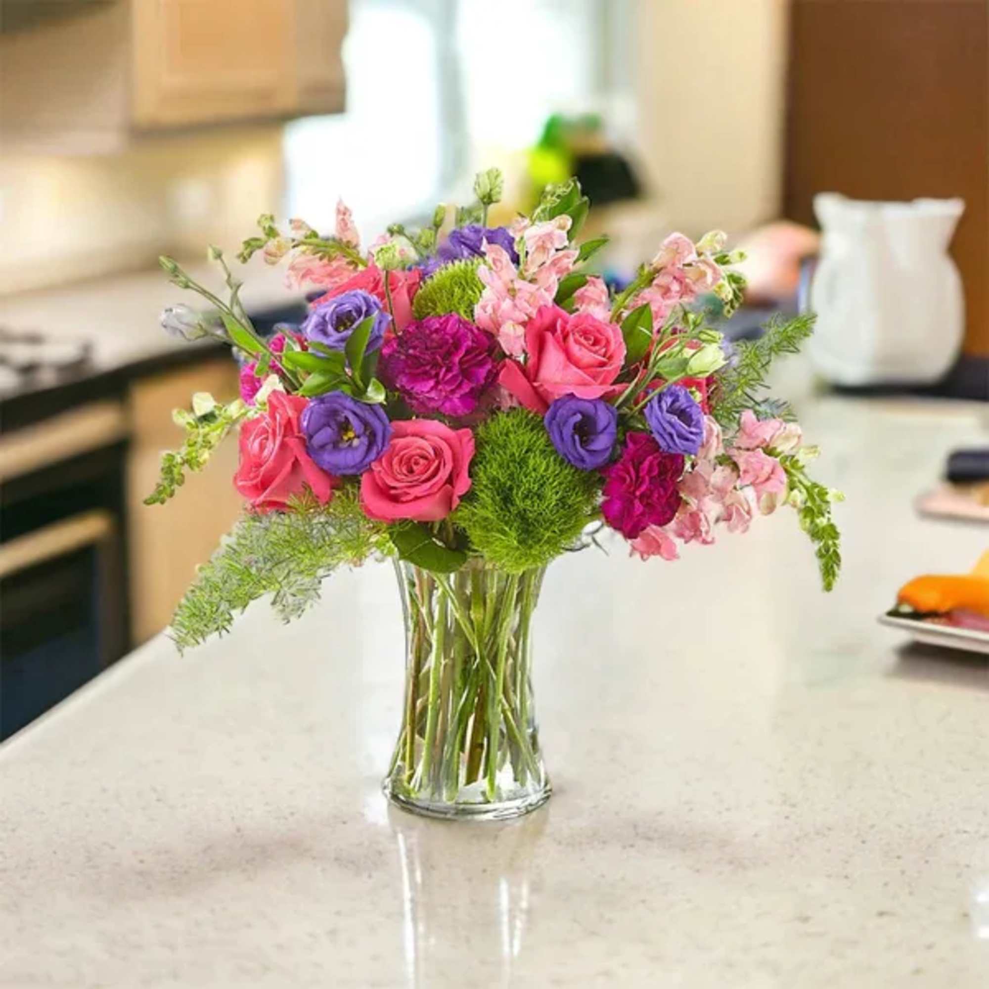 Designed by florists, this bouquet evokes comfort and charm through its bright