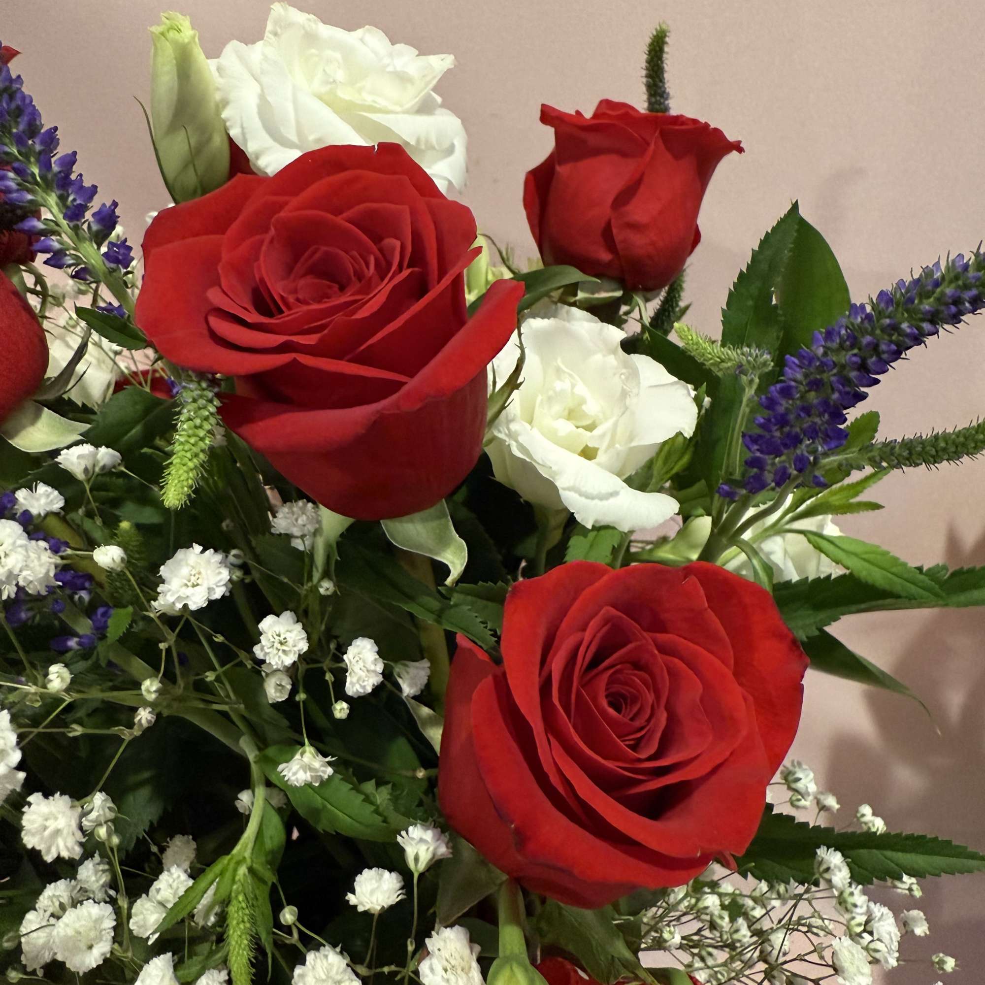 Red roses
White lisianthus and Blue Veronica flowers
