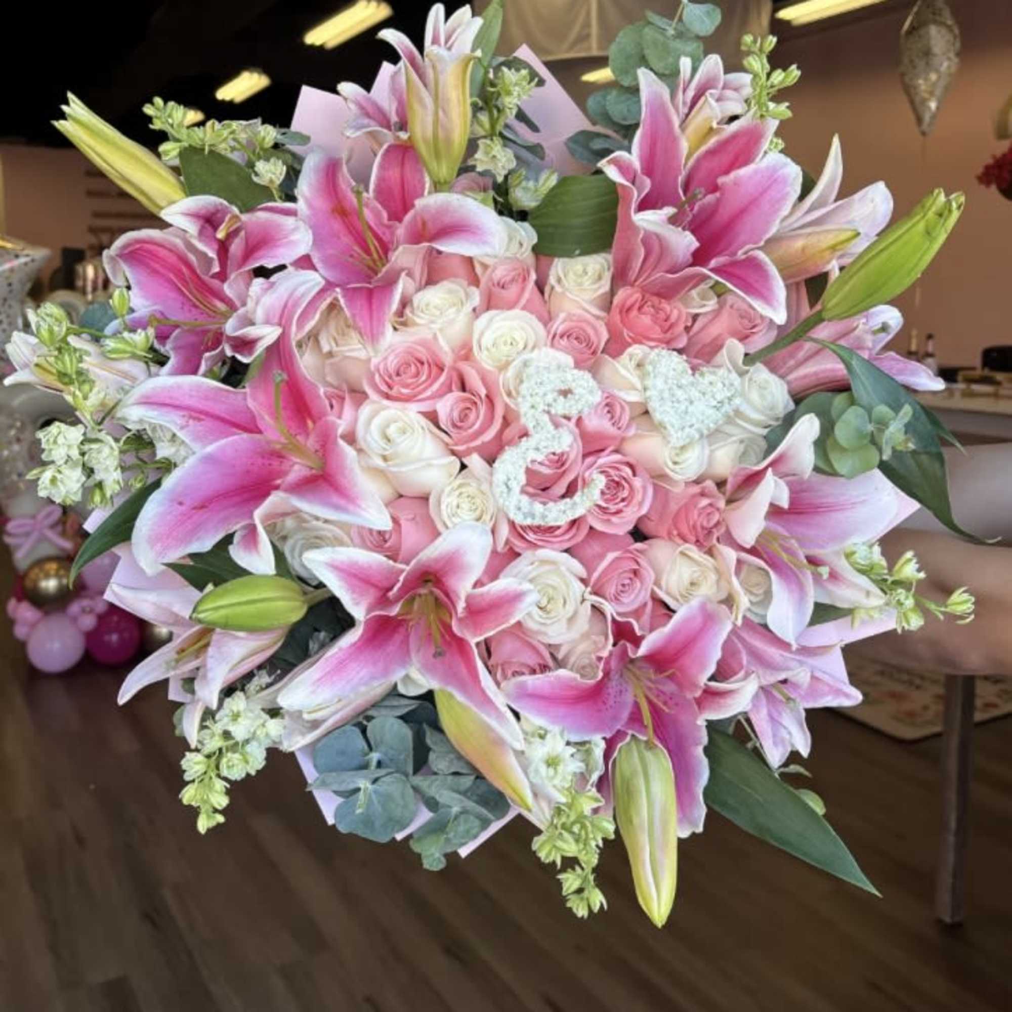 BEAUTIFUL BOUQUET SPRING MIX WITH LILYS, PINK AND WHITE ROSES, SEASONAL GREENERY.