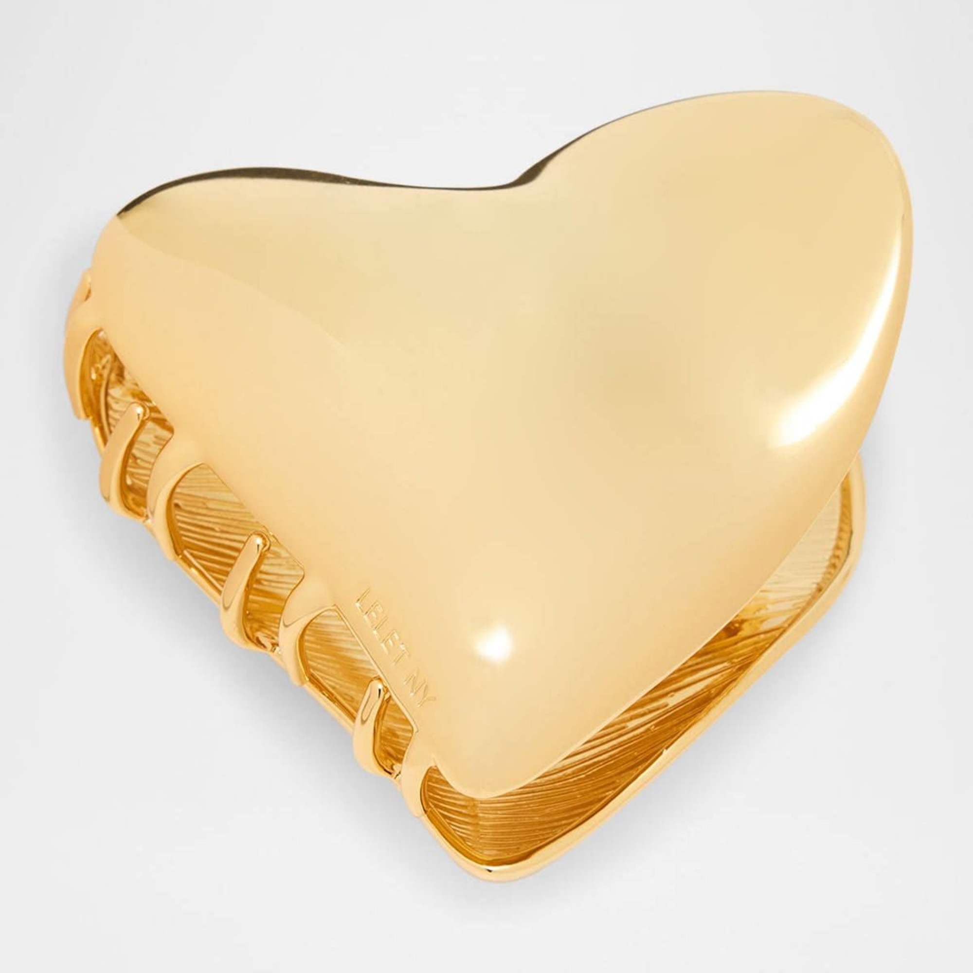 Upgrade your hair with a Heart Metal Claw Clip. Its amorphous heart