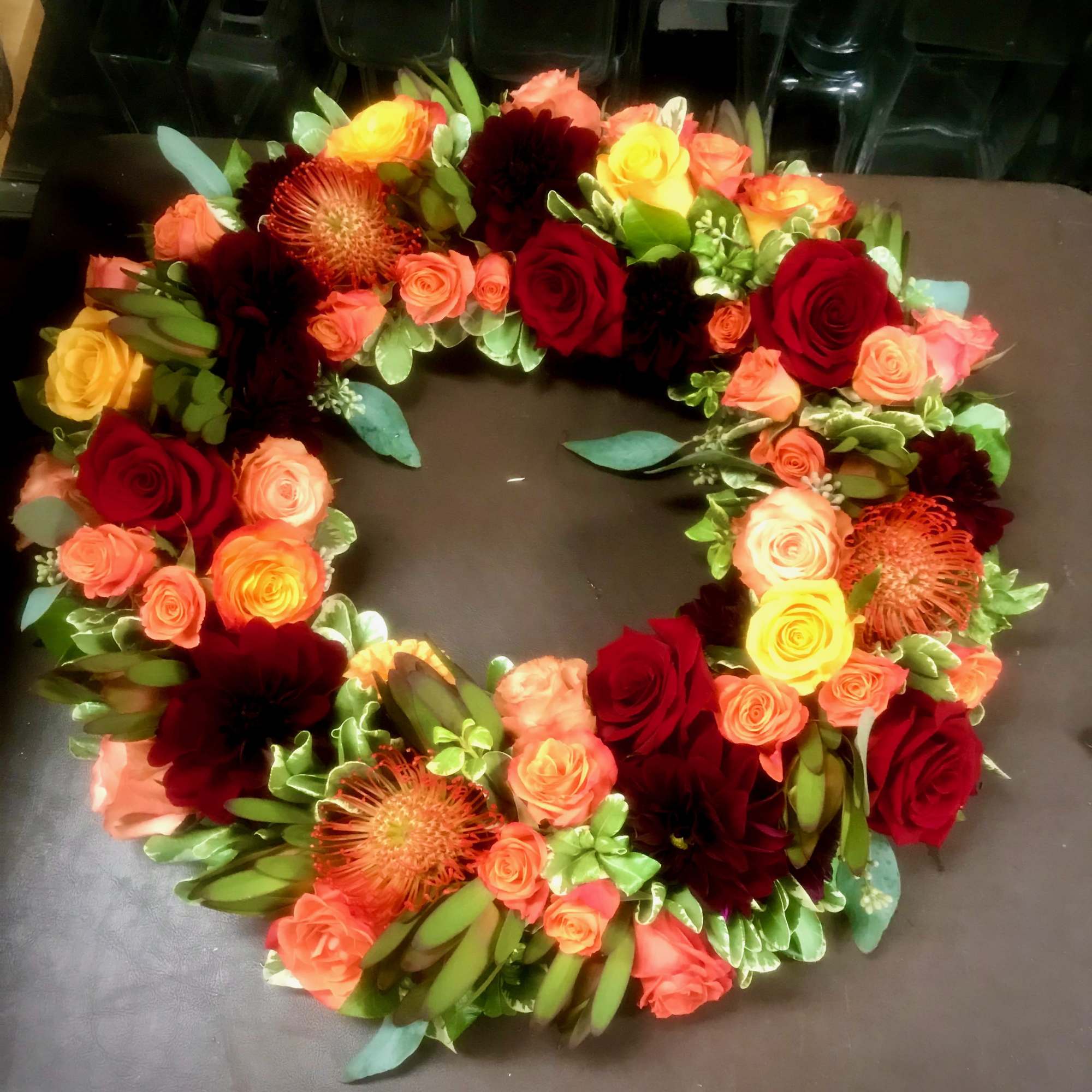 Seasonal blooms in your color palate. Pictured is Dahlias,lilies, hydrangea, ranunculus, Roses