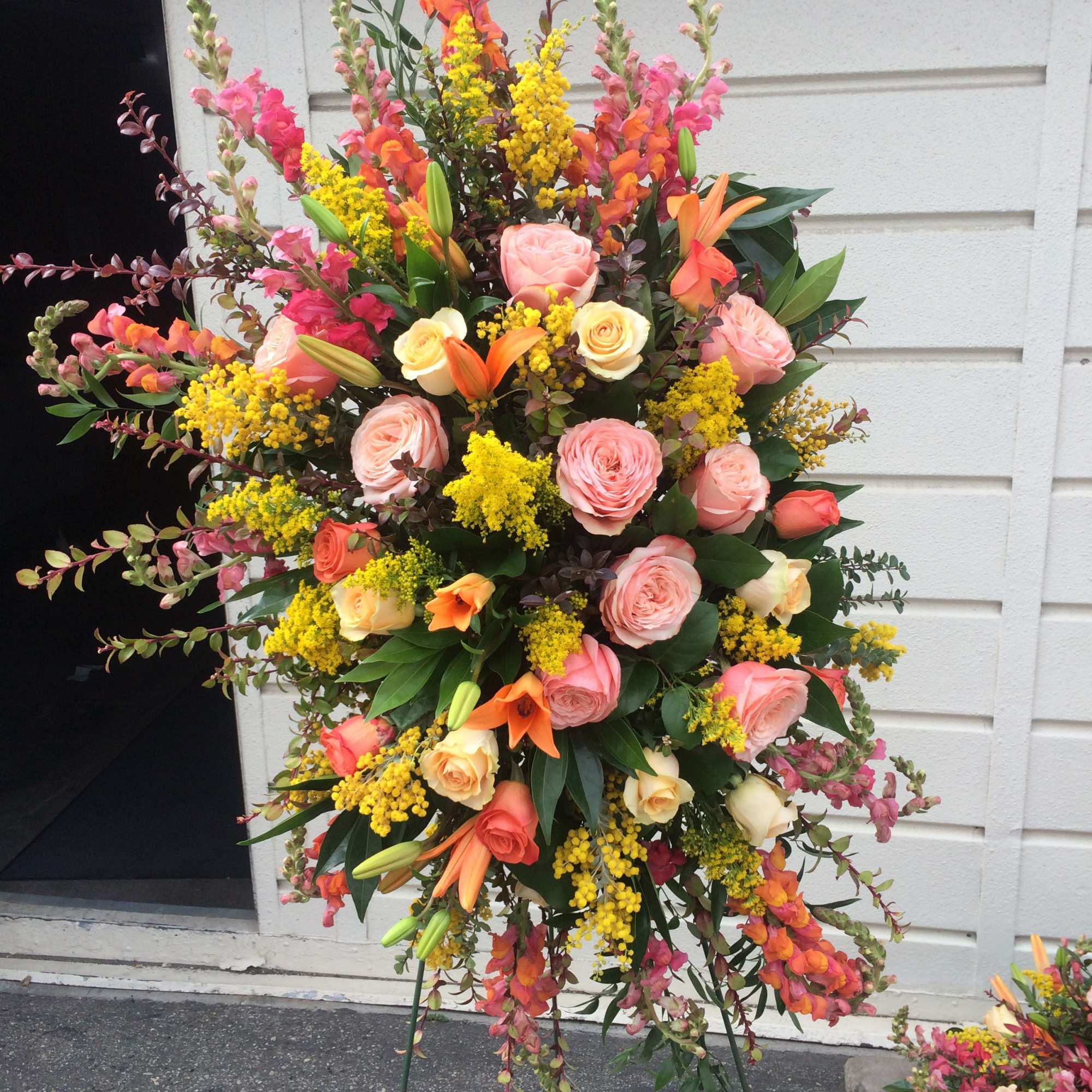a colorful selection of seasonal blooms to celebrate the life of a