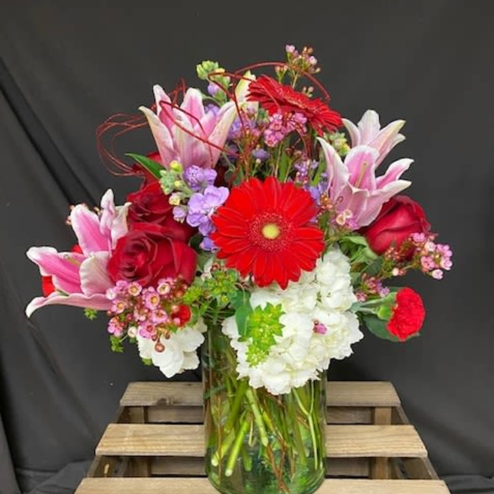 Designed In House! This beautiful mix of fresh blooms is a perfect