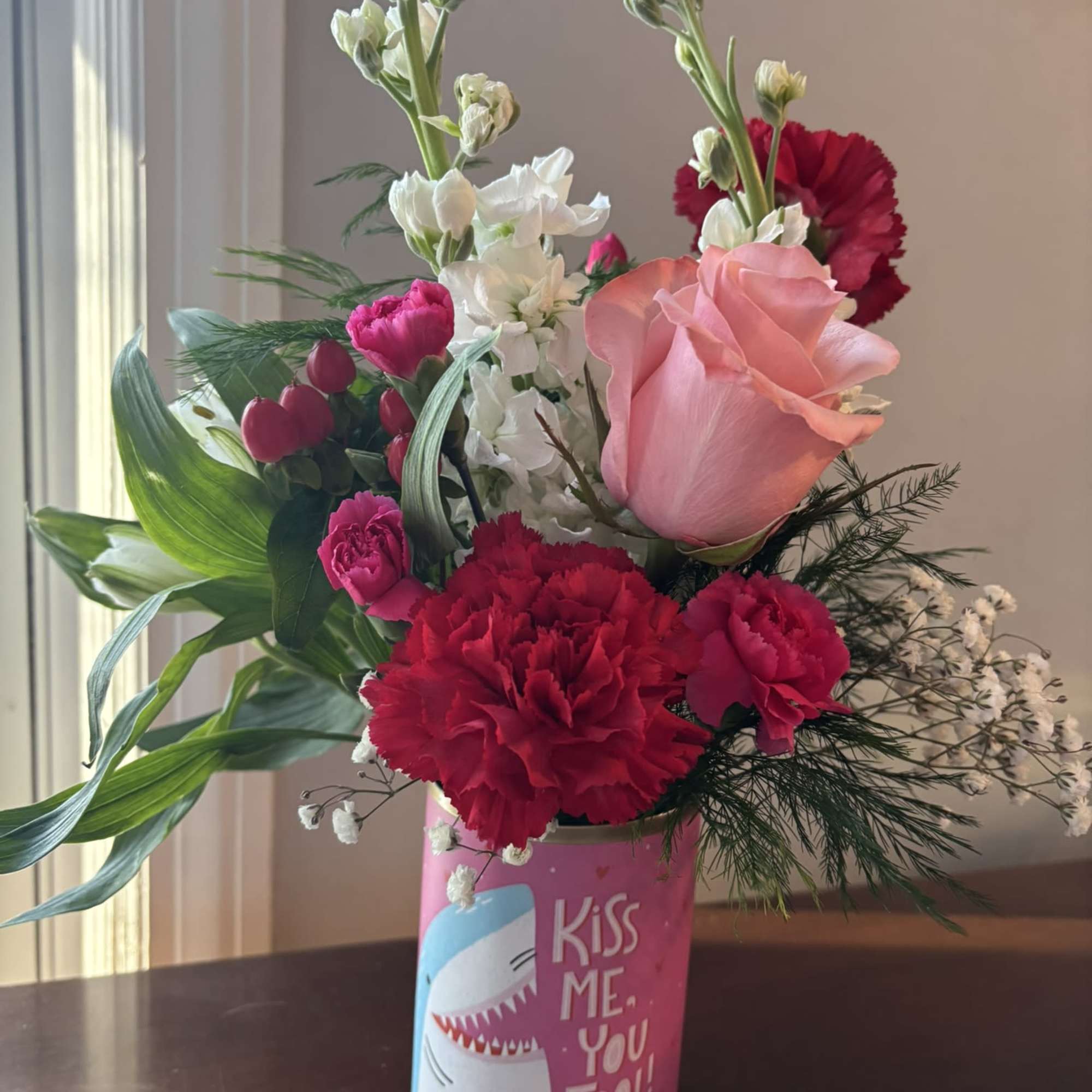 A colorful Valentine arrangement in a vessel that sends a message. 