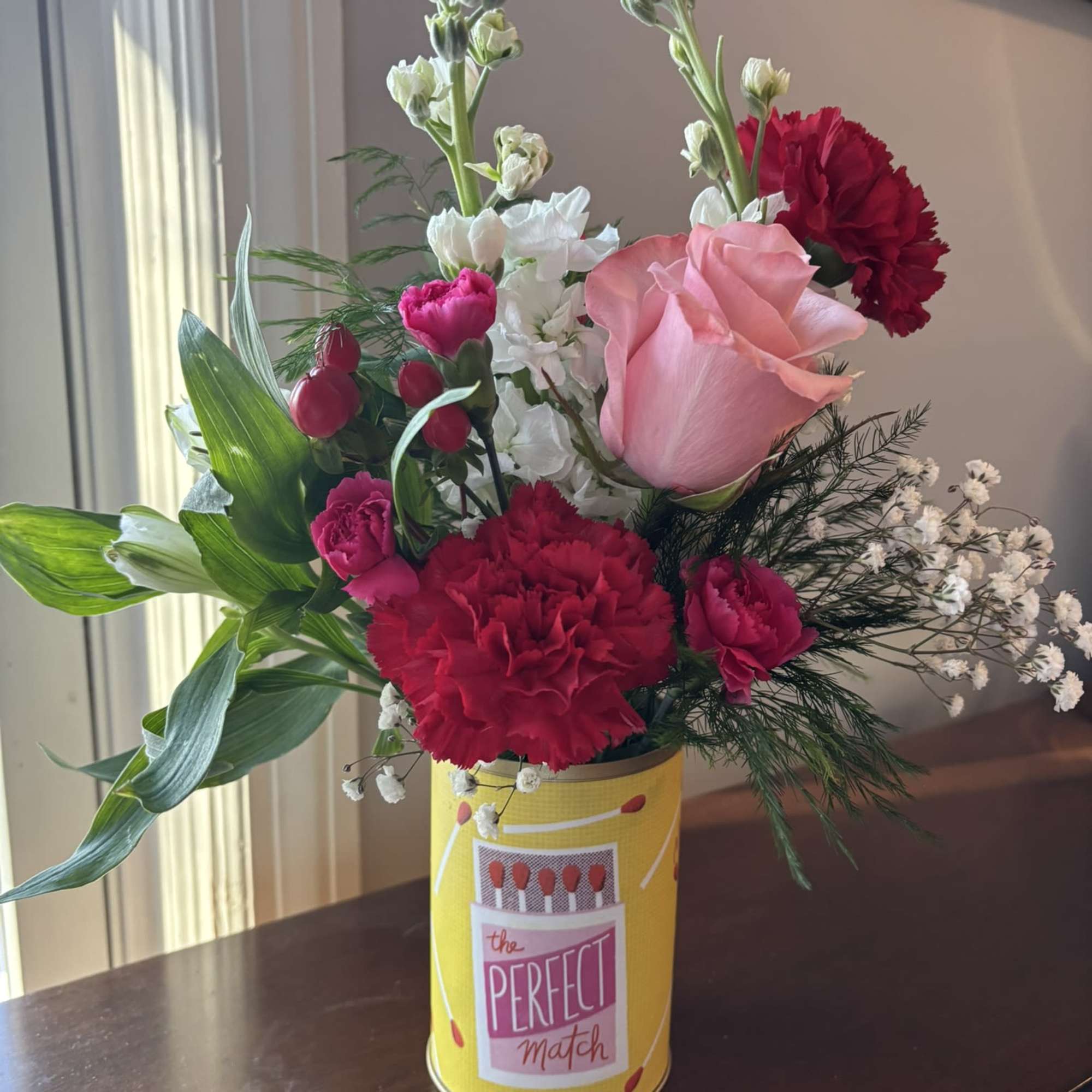 A colorful Valentine arrangement in a vessel that sends a message. 