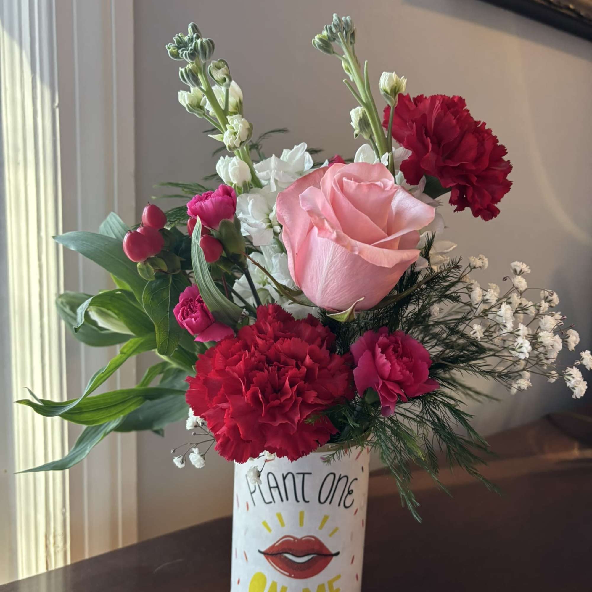 A colorful Valentine arrangement in a vessel that sends a message. 