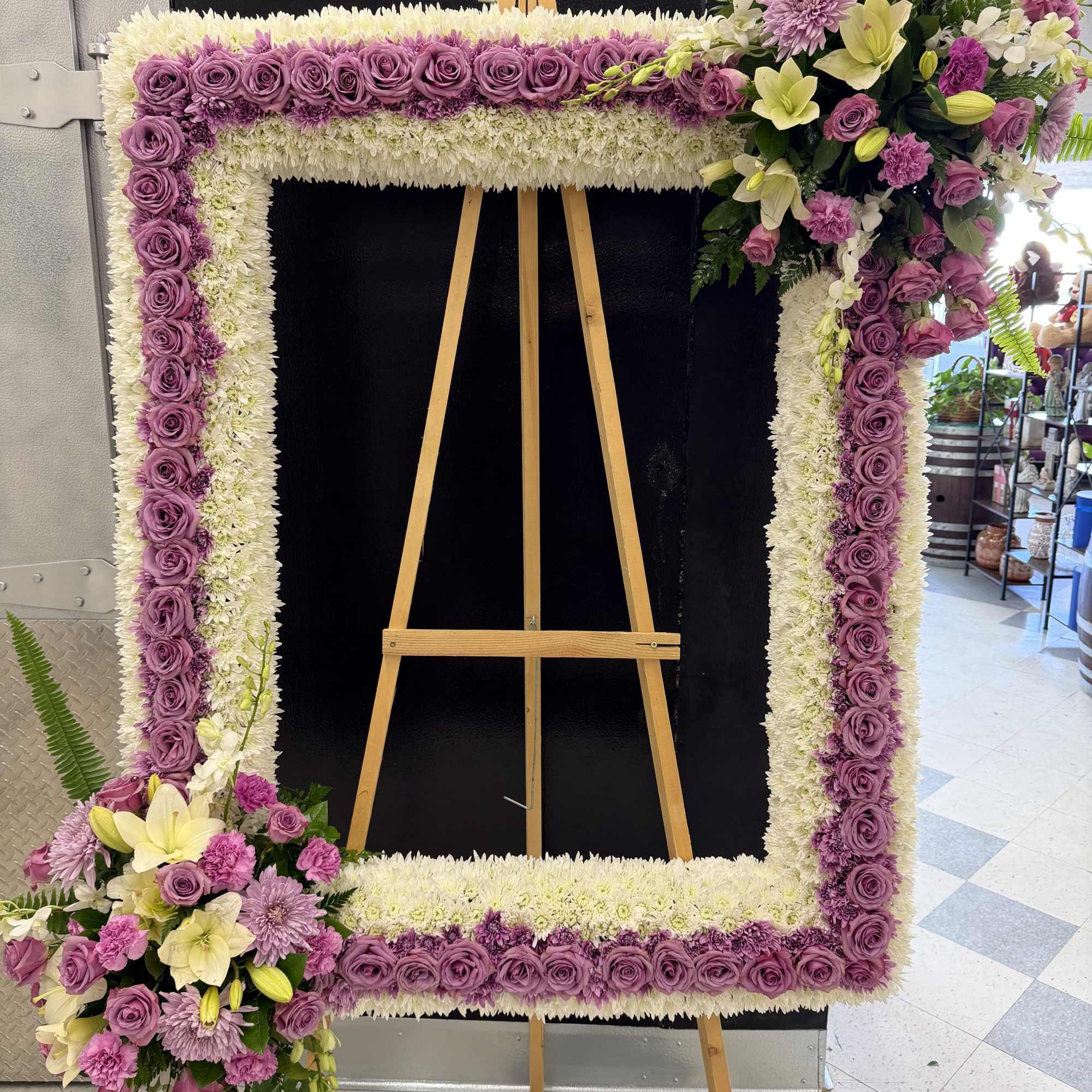 A stunning floral picture frame tribute designed to honor a loved one