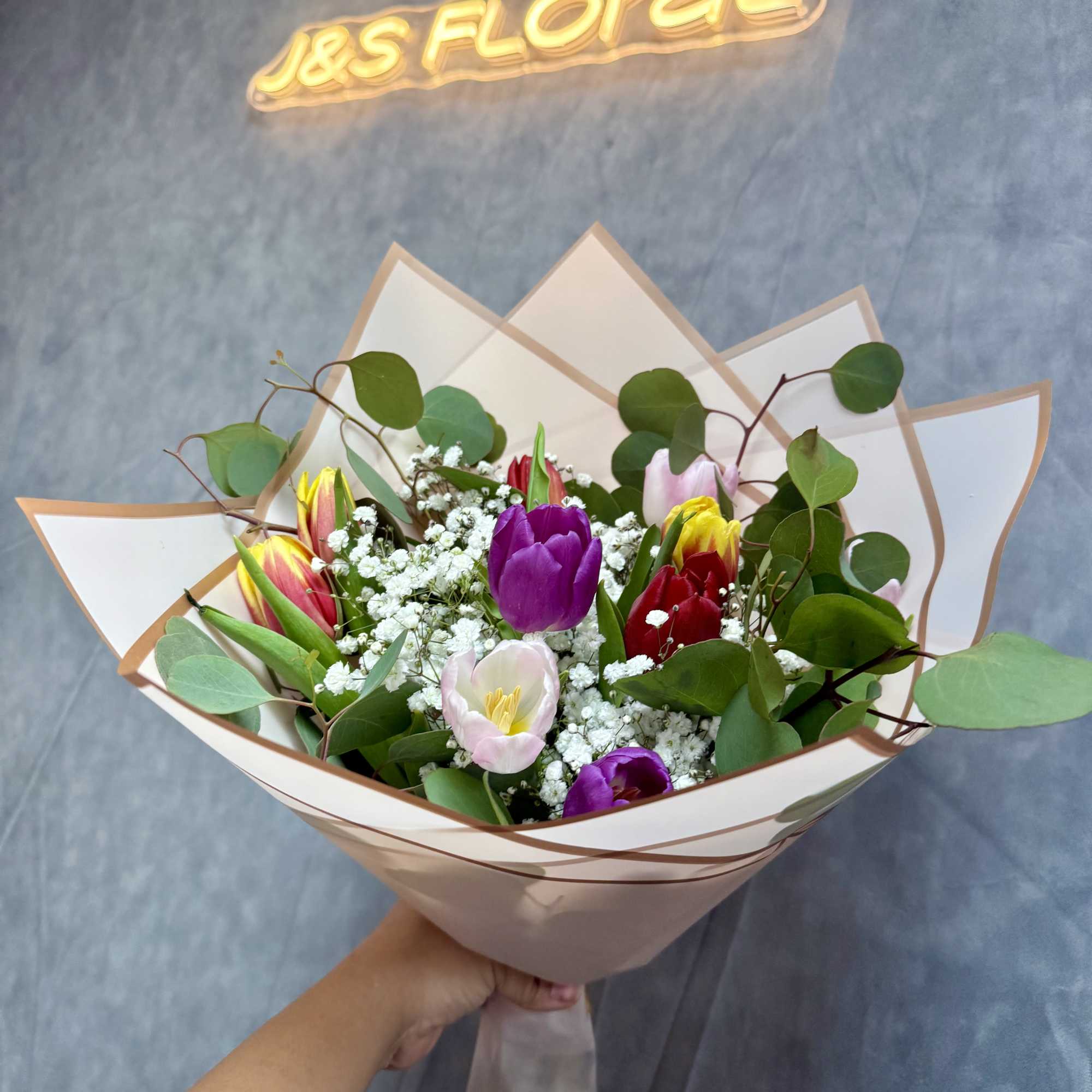 A stunning bouquet of fresh vibrant tulips arranged to bring elegance 